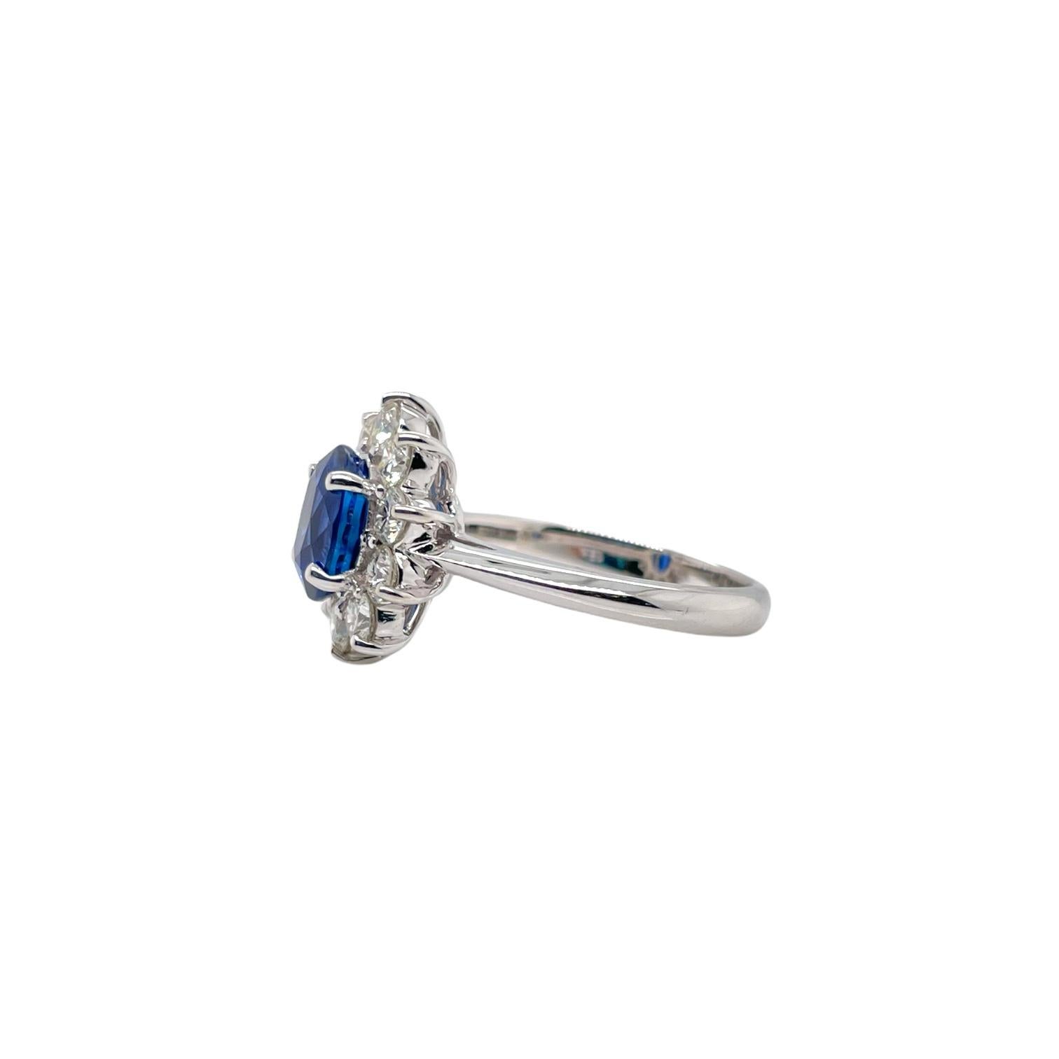 Ring contains 1 center oval brilliant sapphire, 2.14ct and 10 round brilliant diamonds, 1.00tcw. Diamonds are F in color and VS in clarity, excellent cut.  Sapphire is GIA certified and originates from Madagascar. Ring is a size 6.5 and can be
