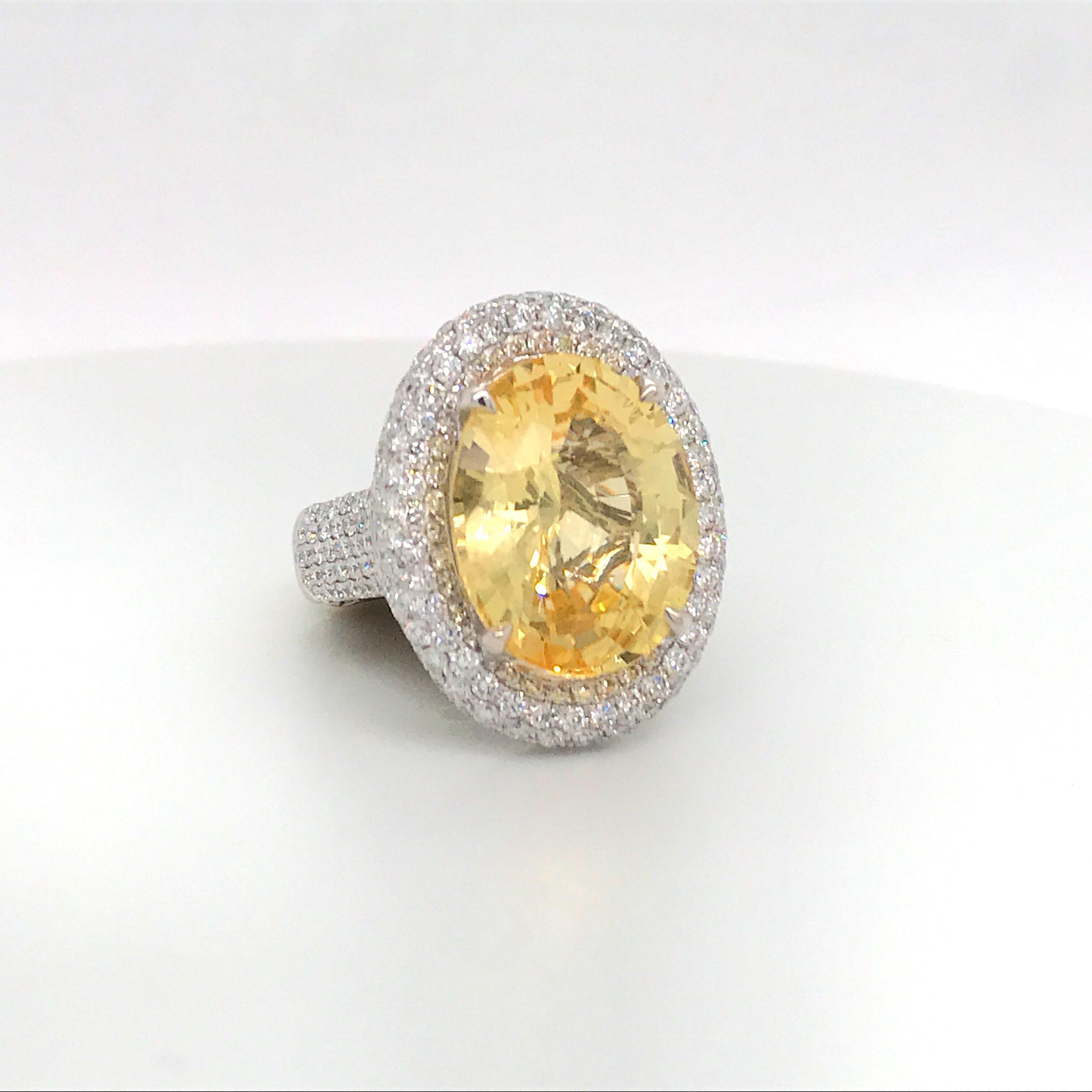18K Yellow gold cocktail ring featuring one oval shape Yellow Sapphire weighing 14.84 carats flanked with numerous round brilliants weighing 3.08 carats.
Color G
Clarity VS-SI

Sapphire: 16.90 mm x 12.22mm
Ring: 19.57 mm x 23.87 mm

Ring is