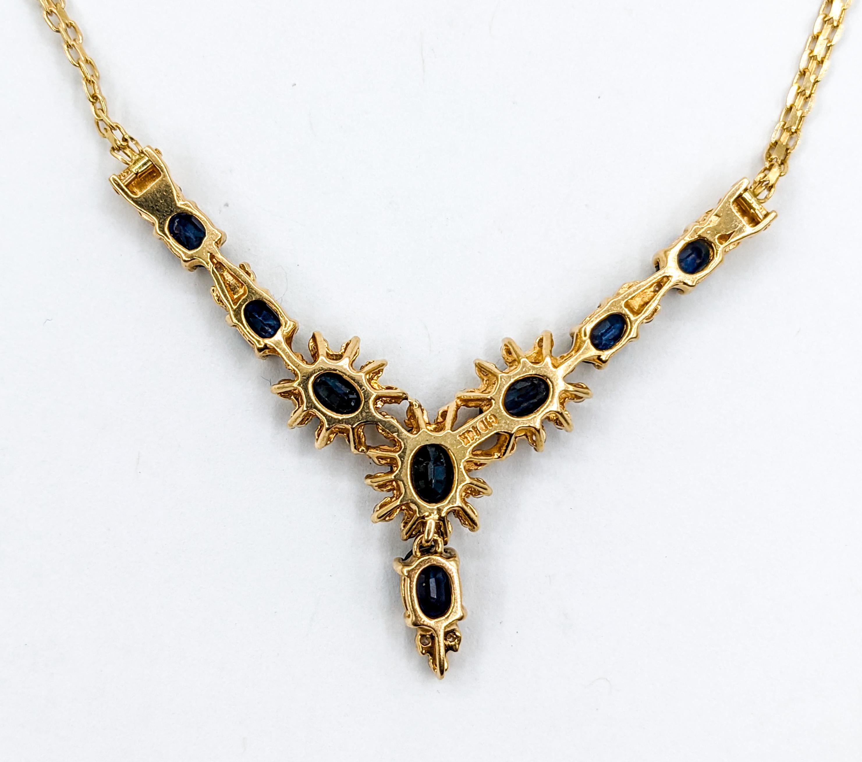 Sapphire & Diamond Halo Necklace in Yellow Gold

This stunning Sapphire necklace is meticulously crafted from 14-karat yellow gold. The three center sapphires feature glittering diamond halos, the diamonds total 0.33ctw. The diamonds, with their