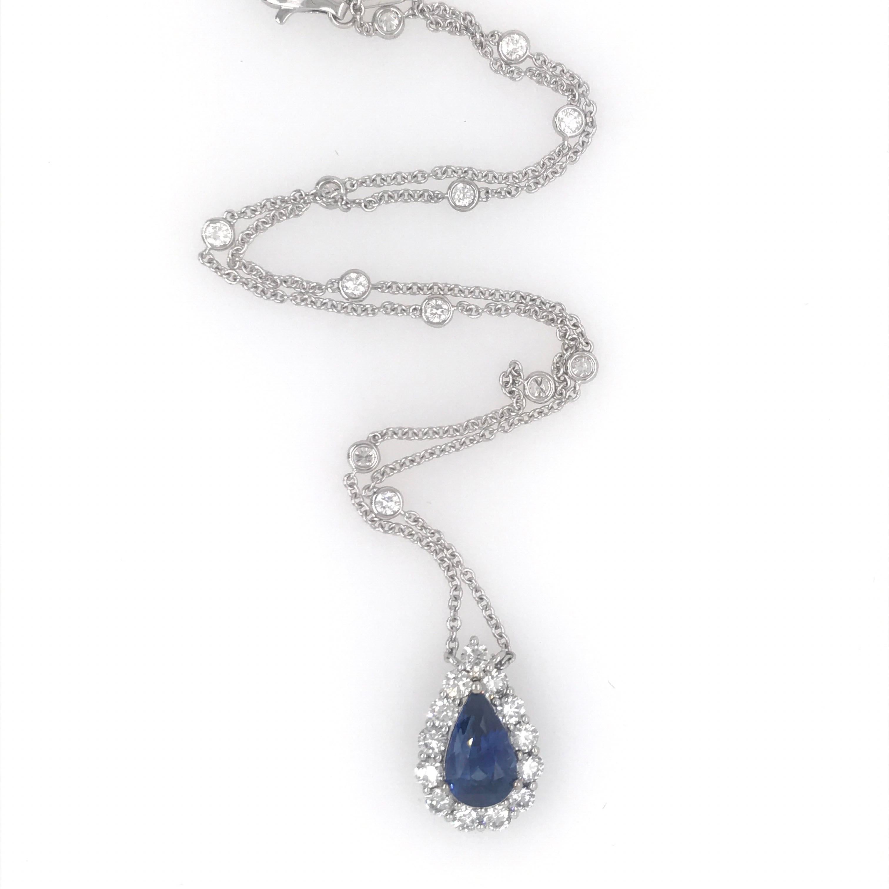 18K White gold necklace featuring one blue pear shape sapphire weighing 4.07 carats flanked with 13 round brilliants weighing 1.35 carats on a diamond by the yard weighing 0.69 carats.
Color G-H