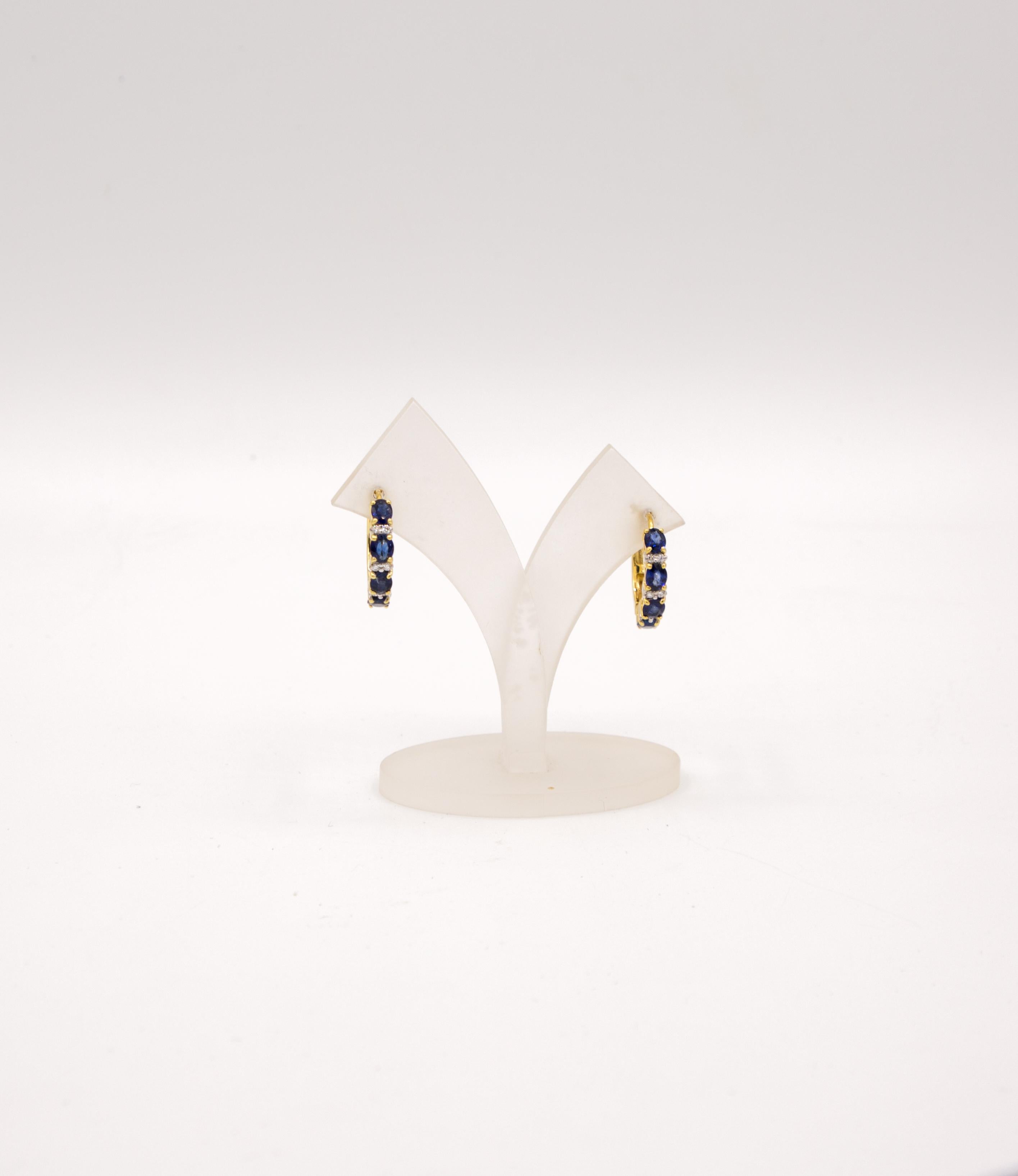 This hoop earrings has 2,66 ct sapphire
0,12 ct diamond all is setting in 18 k yellow gold
diameter is 20 mm 
weight is 7,73 gram

it is a earring for everyday 