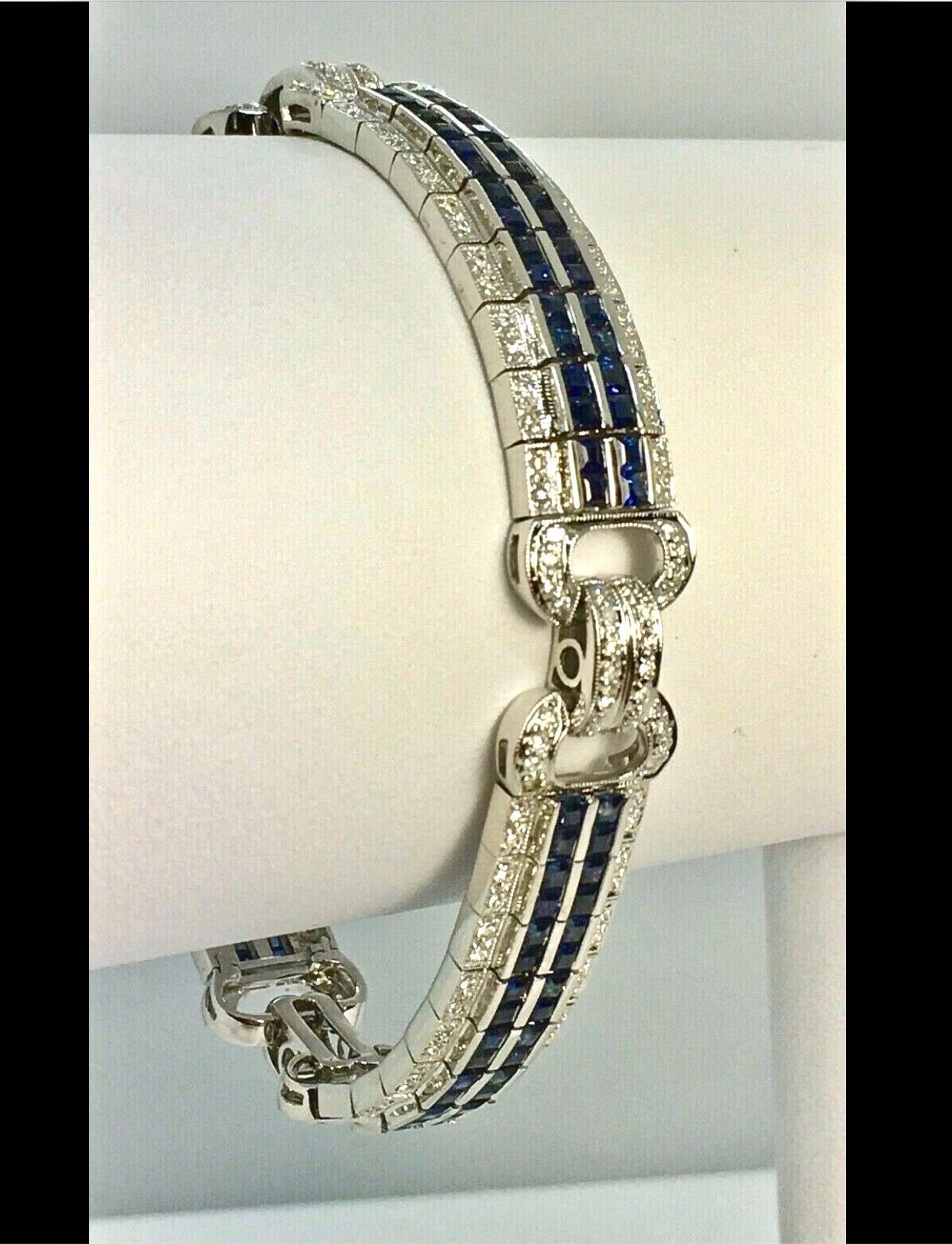 Vintage Estate 18K white gold bracelet, designed as four articulated panels, centrally comprised with two rows of calibré cut natural sapphires, flanked by brilliant natural diamonds. Length 7.25″

Sapphire  Weight : 8.55 Carats
Diamond 1.20 carats