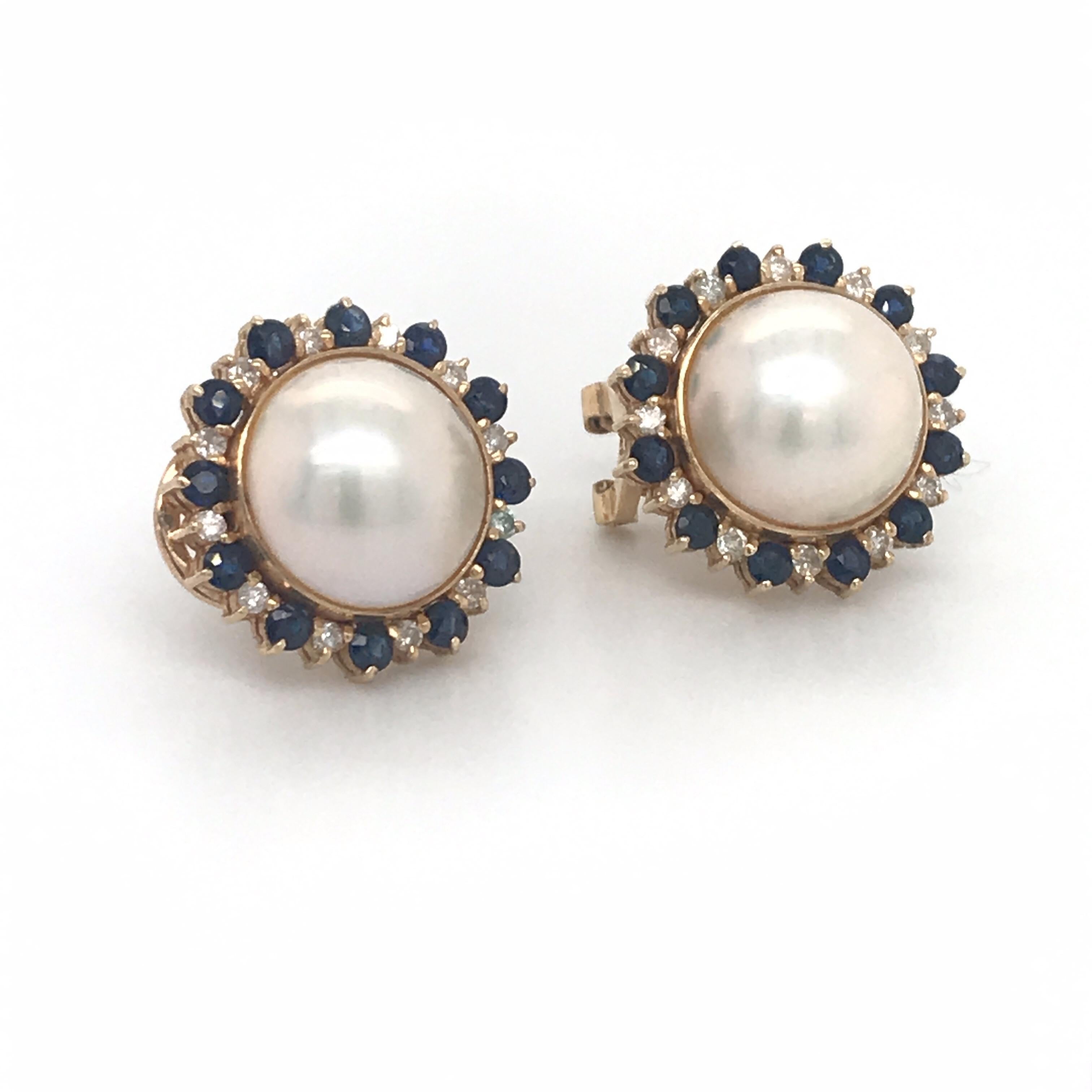 14K Yellow gold stud earrings featuring two Mob pearls measuring 11-12 mm flanked with alternating sapphire and diamonds. 
Color G-H
Clarity SI