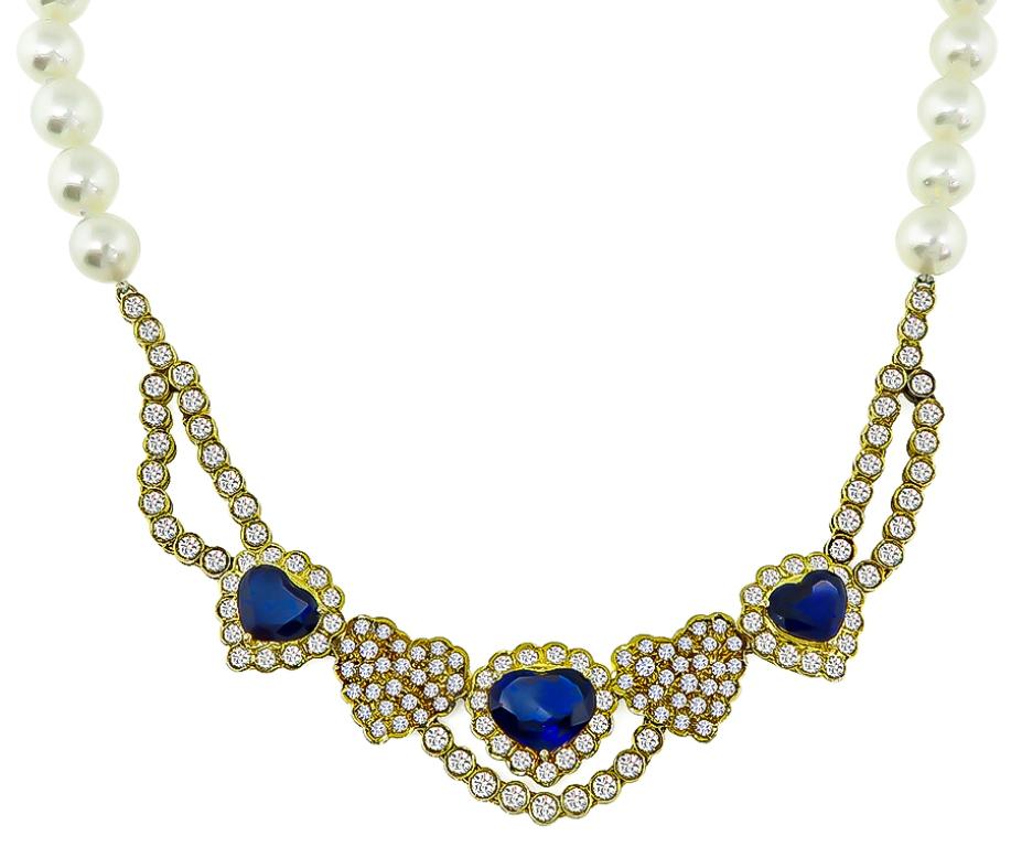 This amazing necklace and earrings set features high quality heart shaped sapphires that weigh approximately 9.00ct. The sapphires are accentuated by sparkling round cut diamonds that weigh approximately 7ct graded G-H color with VS clarity. The
