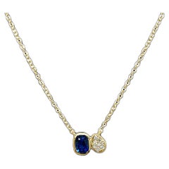 Colgante de zafiro y diamantes en oro amarillo de 18 ct, con cadena de oro de 18 ct