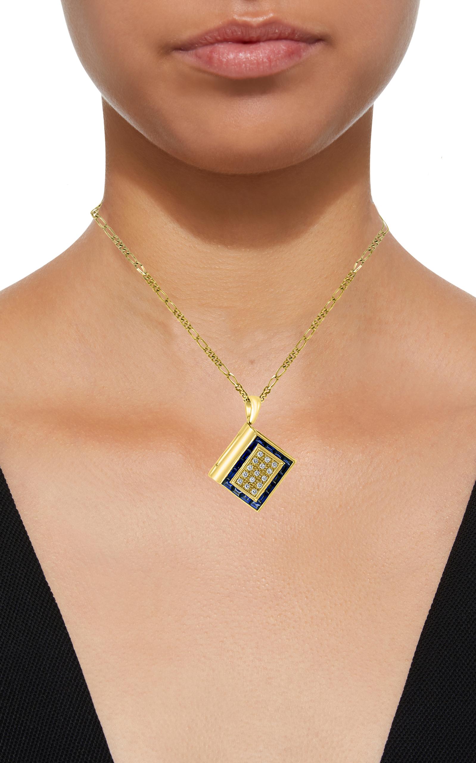 A beautiful Book Pendent with Two sleeves , each sleeve  has two pages.
All pages are made of mother of pearl .
Made in 18 Karat yellow  gold .
18 K gold Weight  15.2 Grams.
Comes with 18 K gold Chain
Cover of the book has 15 brilliant round