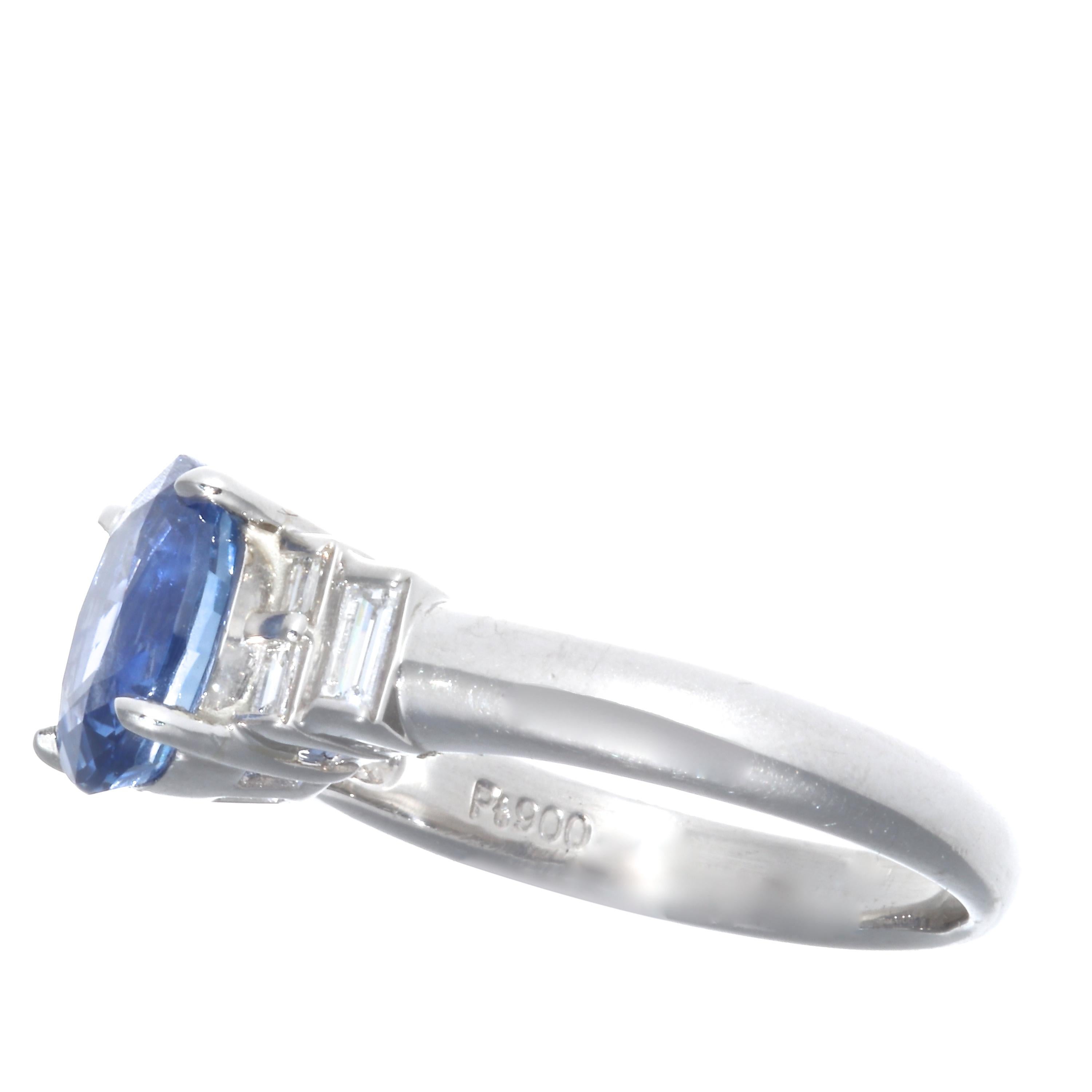 A bright cornflower blue 2.27 carat sapphire diamond platinum ring. With 6 baguette diamonds weighing approximately 0.28 carats that are  D-E color VS+ clarity. Ring size 5 1/2 and may easily be re-sized. Circa 2000's
 Flawless Protection Plan: 
7