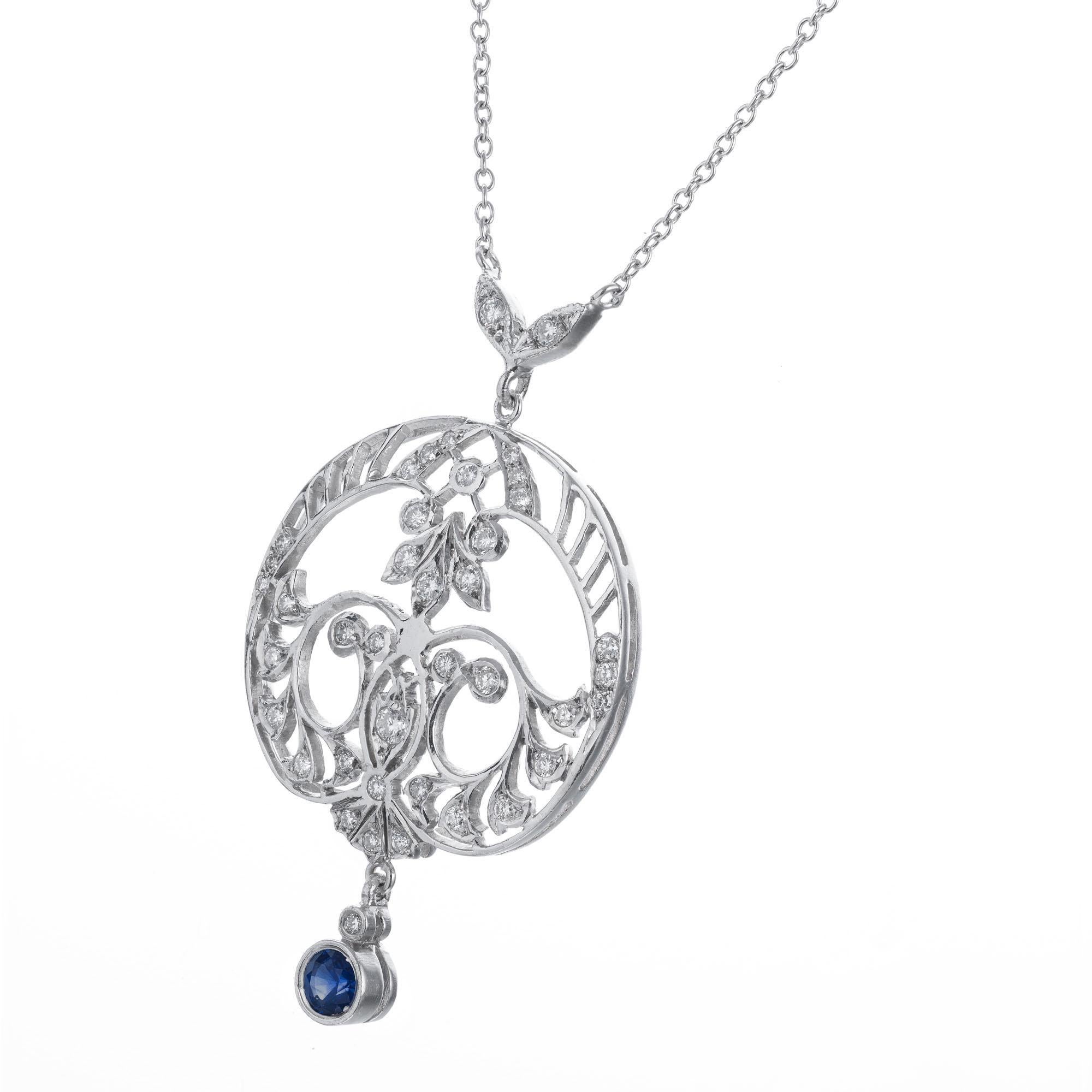 Art Deco sapphire and diamond pendant necklace. Filigree open work pendant with 35 round diamonds and a diamond and round vivid blue sapphire drop. Length center round section 1 inch by 7/8 inch.  2 diamonds in a “V” pattern are attached to the top