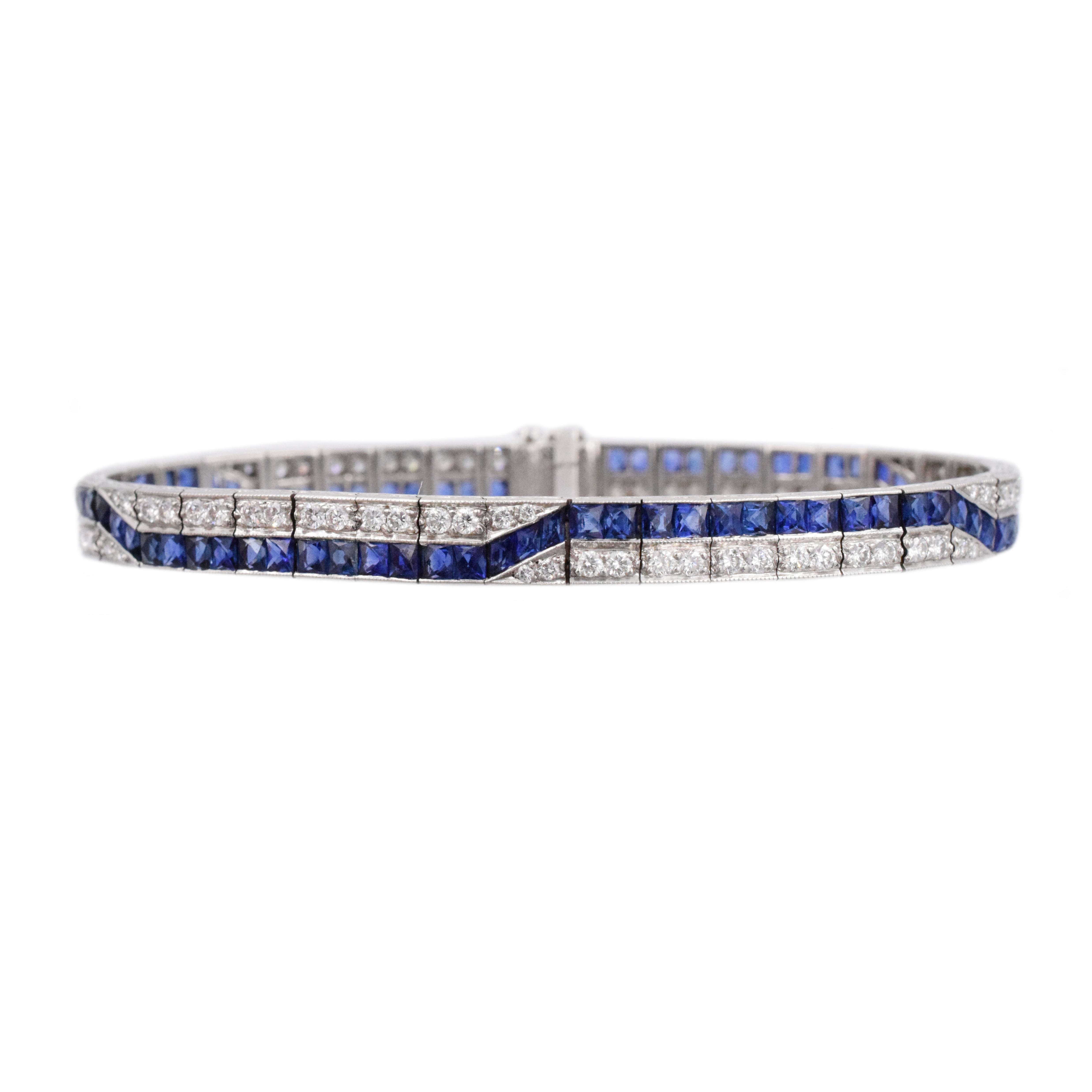 Classic sapphire and diamond line bracelet with a wave design. estimated total weight of  french cut sapphire is 12.5 carats and brilliant shape diamonds are 2.45 carats set in Platinum.

Length is 7 inches
Width: 7mm