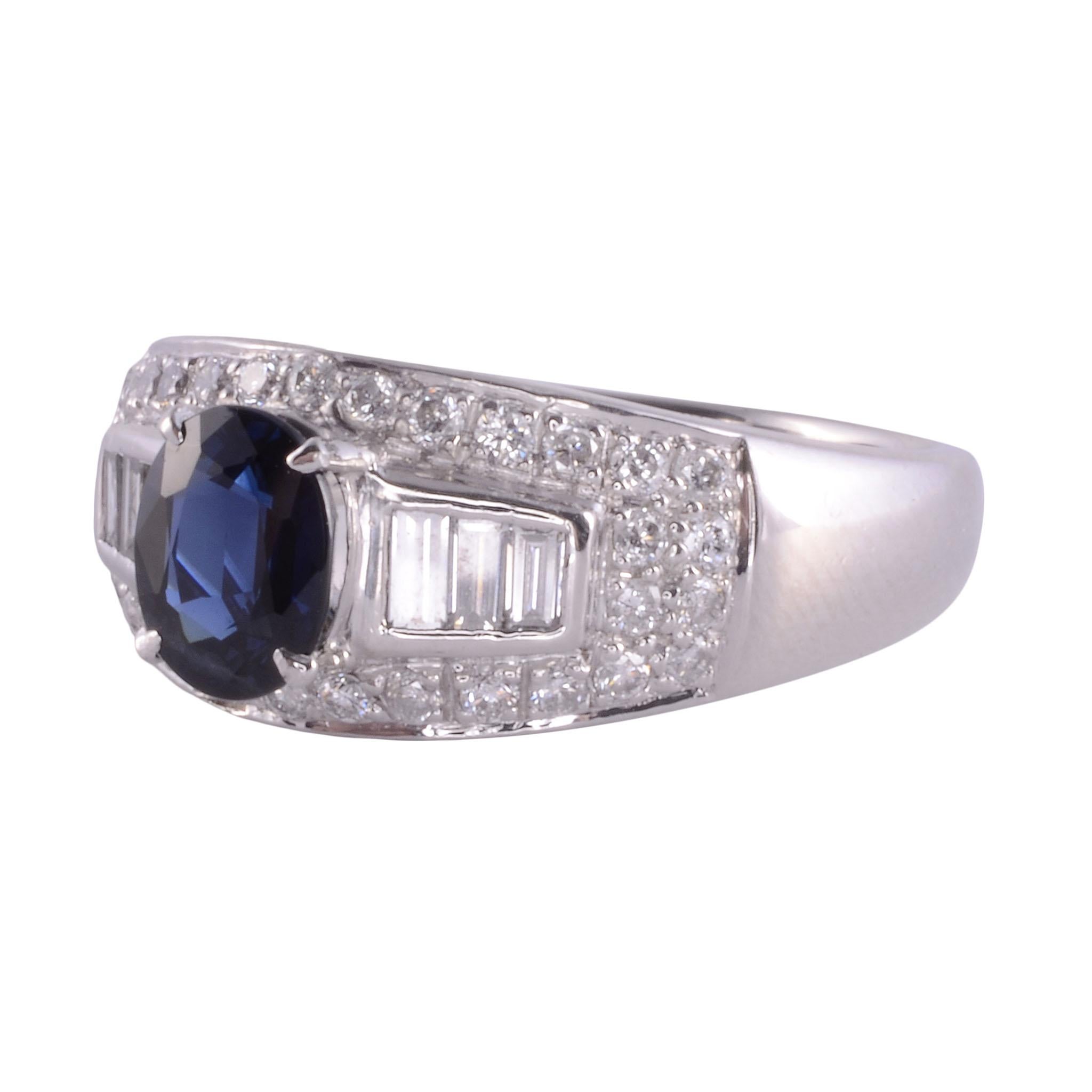 Estate sapphire diamond platinum ring. This platinum ring features a 1.34 carat oval sapphire center accented with .76 carat total weight of round & baguette diamonds. The diamonds have SI1-2 clarity and G-H color. This sapphire ring weighs 12.20