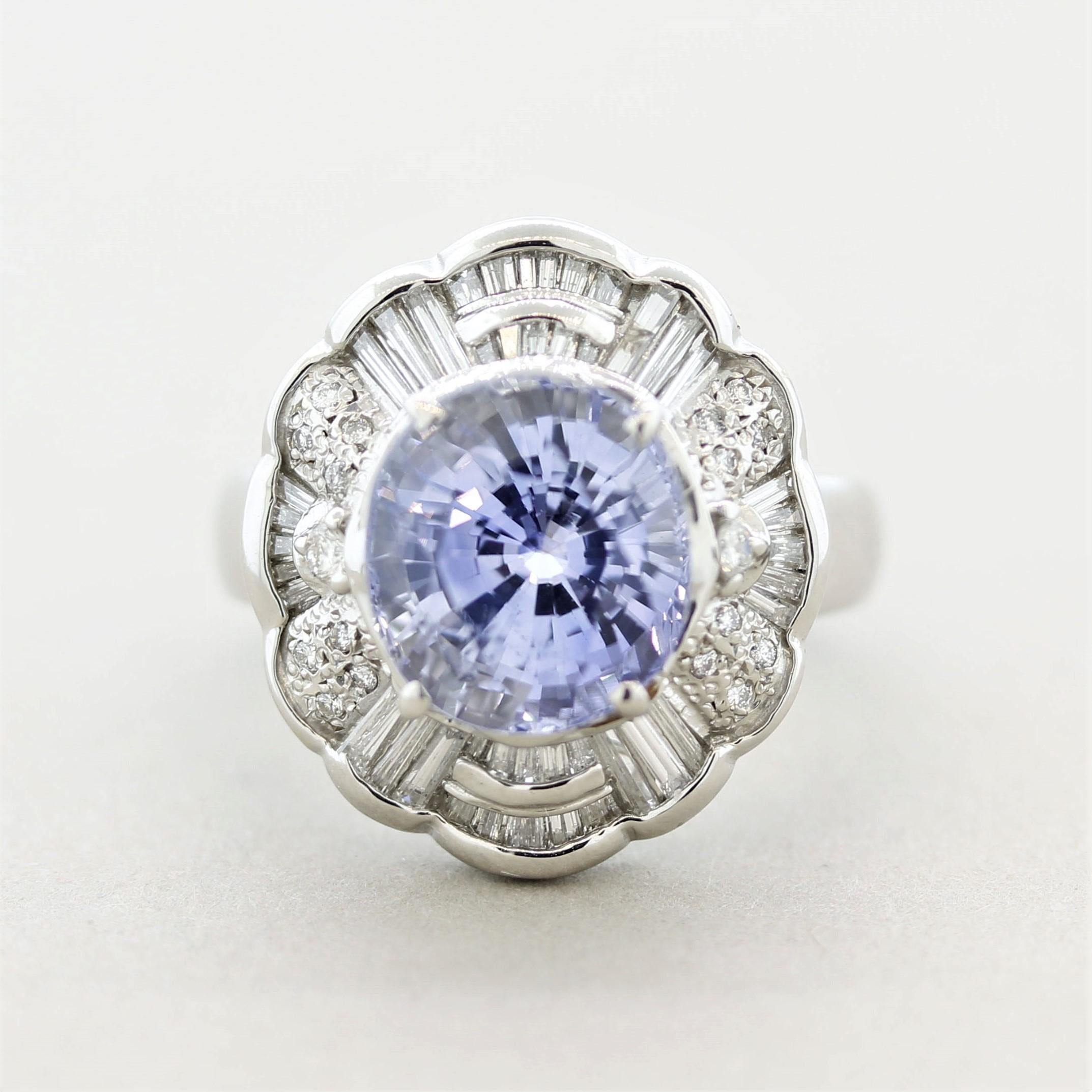 A bright and vibrant 6.50 carats blue sapphire takes center stage! It is a light yet brilliant blue color that is free of any eye-visible inclusions allowing the stones brilliance to showcase. It is accented by 0.79 carats of round brilliant-cut and
