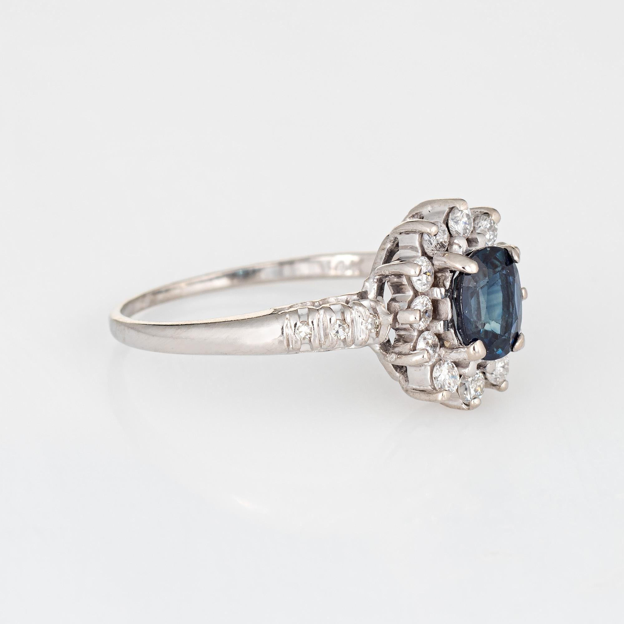 Stylish sapphire & diamond princess ring crafted in 14 karat white gold. 

Oval faceted blue sapphire is estimated at 1 carat, accented with an estimated 0.30 carats of diamonds (estimated at I-J color and VS2-I1 clarity). The sapphire is in