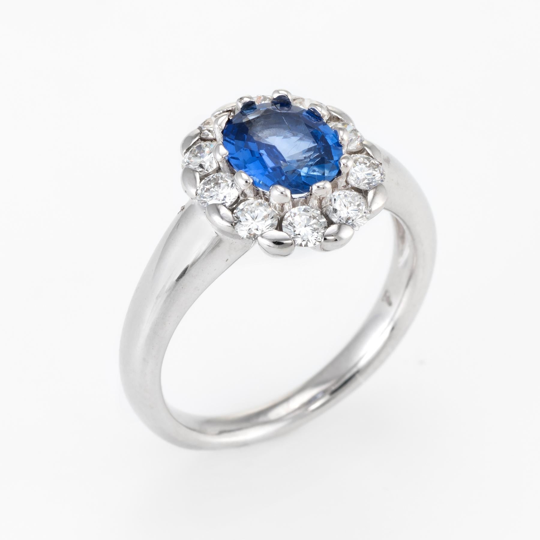 Elegant vintage princess ring, crafted in 18 karat white gold. 

Centrally mounted faceted oval cut sapphire measures 8mm x 7mm (estimated at 1.10 carats), accented with an estimated 0.85 carats of diamonds (estimated at G-H color VS2 clarity). The