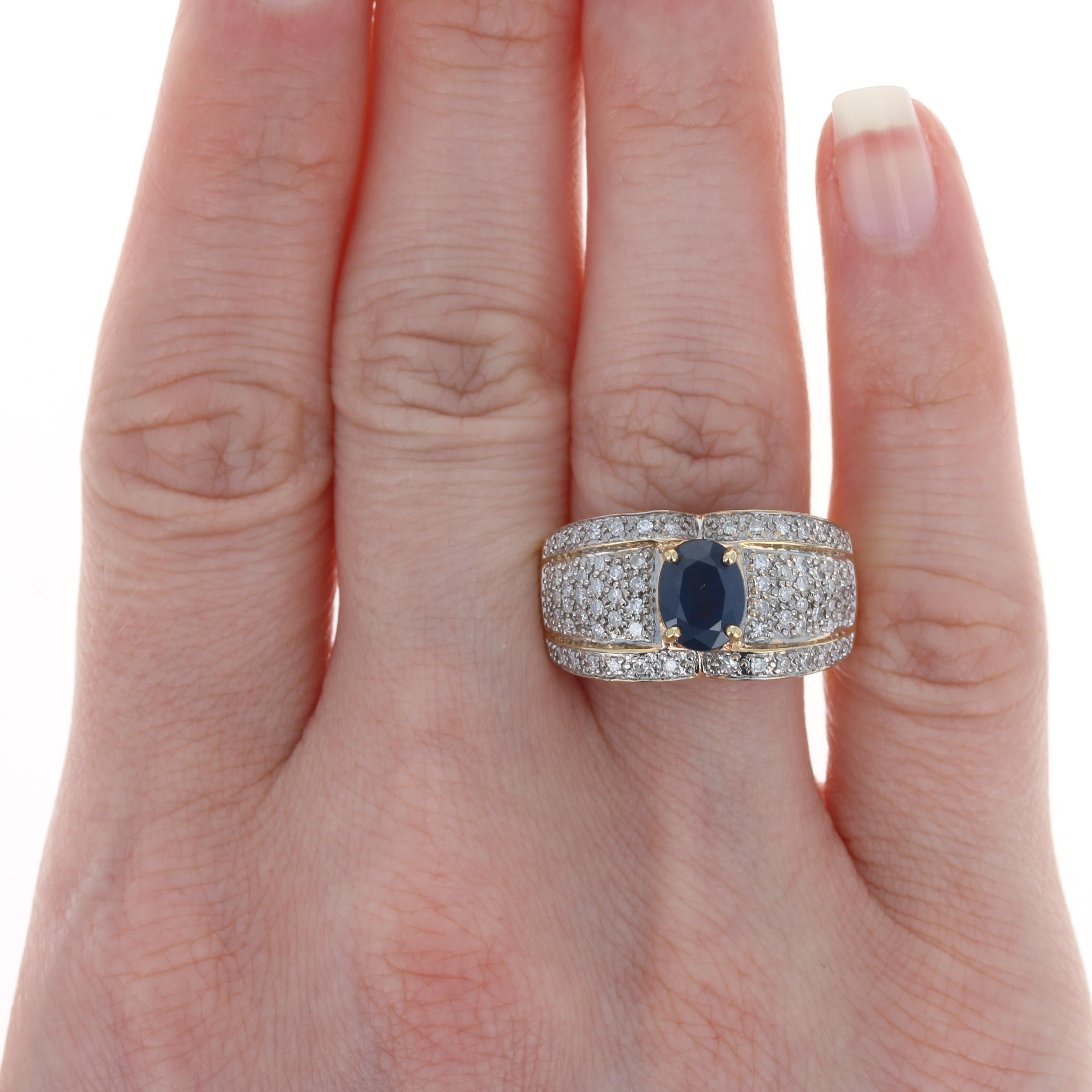 Get ready to dazzle wearing this show-stopping ring with your formal attire! Composed of 14k yellow and white gold, this piece features a majestic blue sapphire solitaire beautifully accompanied by a shimmering array of icy white diamond accents