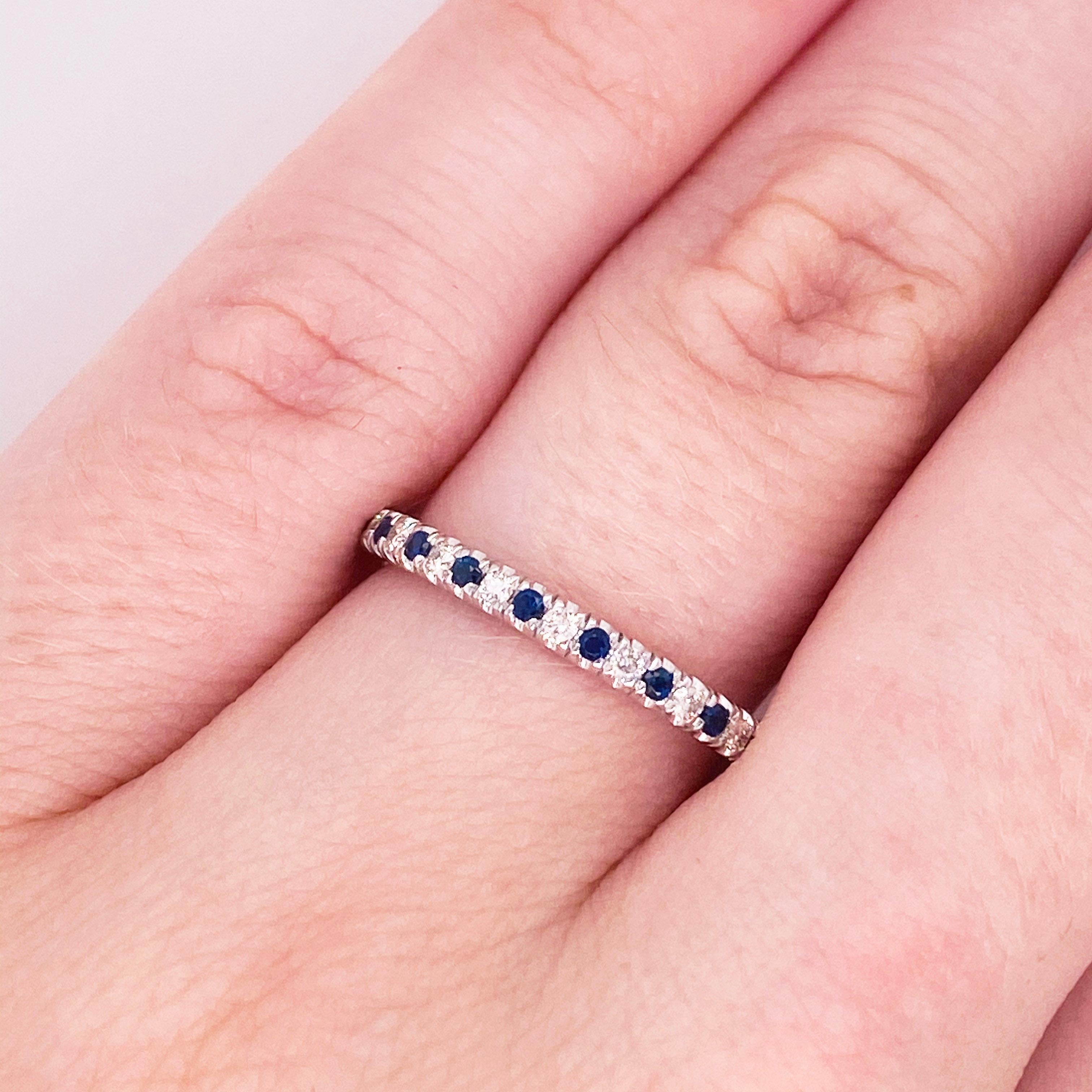 These stunning rich blue sapphires and white diamonds set in polished 14k white gold provide a look that is very classic and modern at the same time! This ring is very fashionable and can add a touch of style to any outfit, yet it is also classy