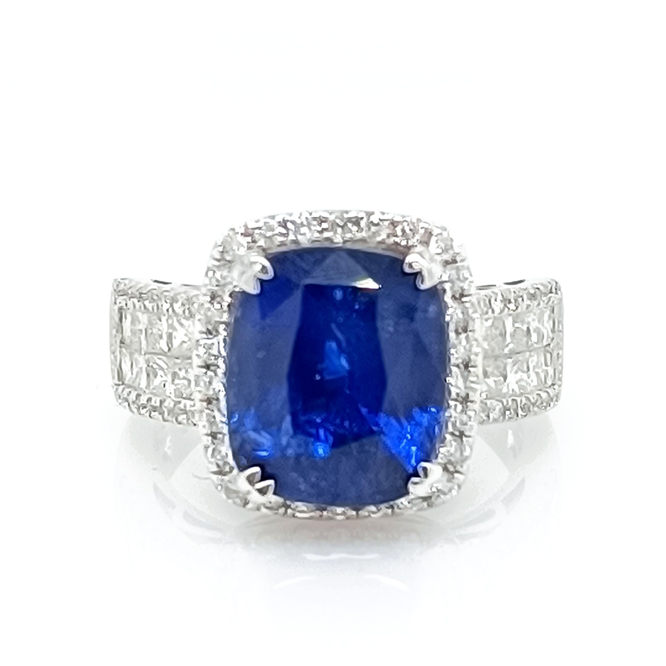 Blue Sapphire 8.26 Cts surrounded by diamond 1.33 Cts  

Set in 14K white gold,  5.99 Grams