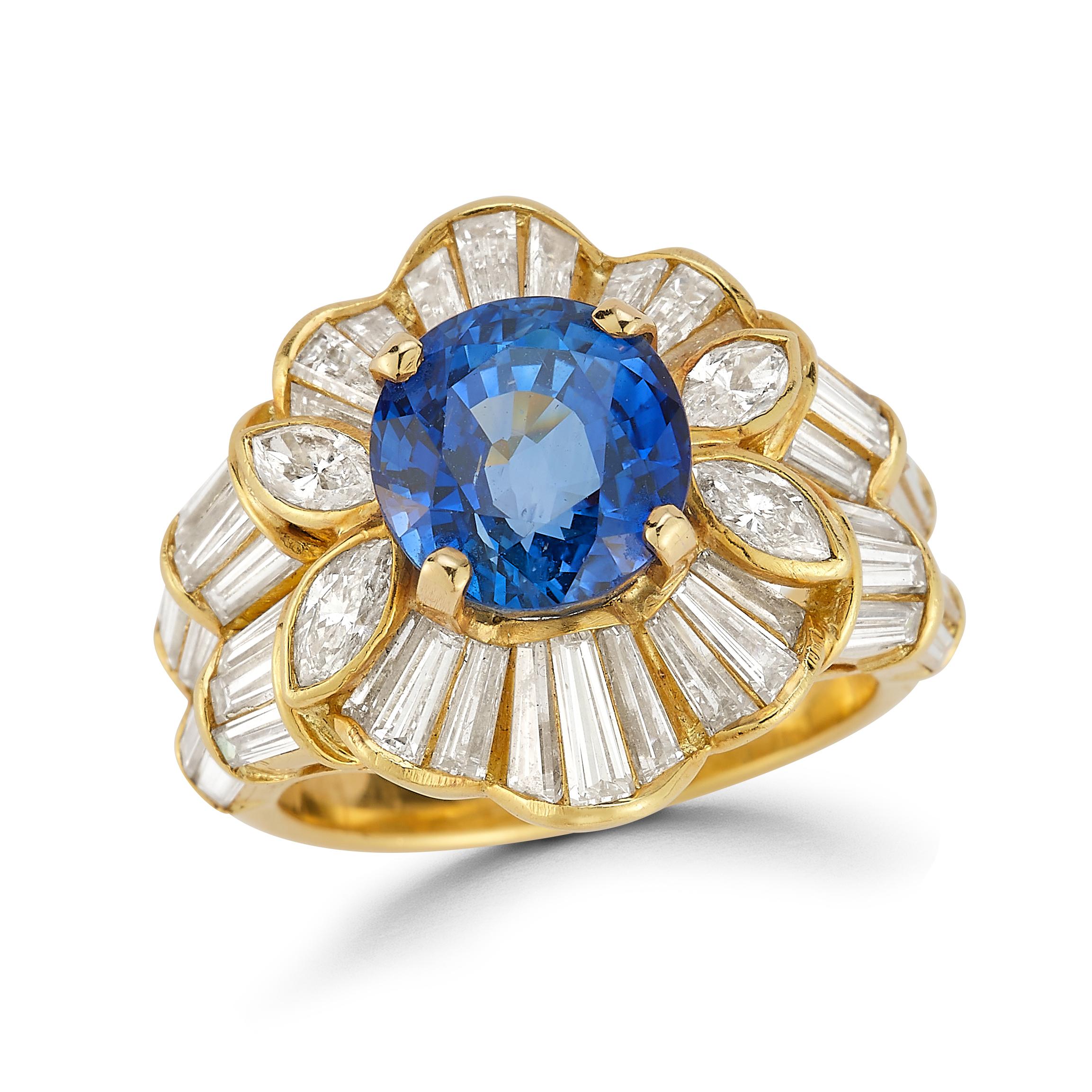 Sapphire & Diamond Ring

An 18 karat yellow gold ring set with an oval cut sapphire framed by marquise and baguette cut diamonds

Accompanied by an AGL report stating that the sapphire is heated and of Ceylon origin

Sapphire Approximate Weight: