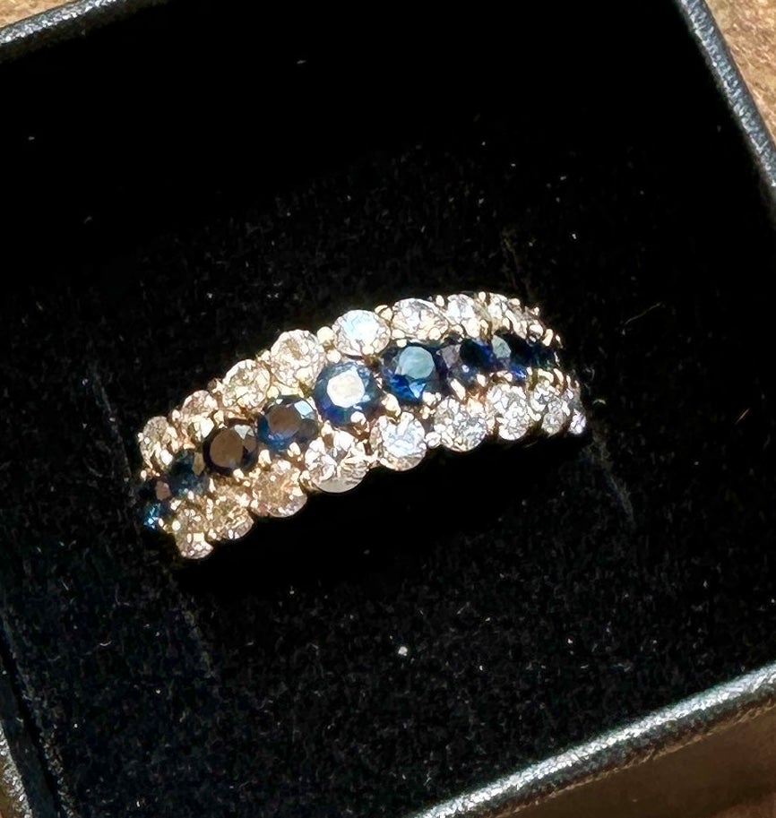 This is an absolutely stunning 1 Carat Diamond, Natural Sapphire Antique Wedding Engagement Band Ring in 14 Karat Gold.  The ring has been very conservatively appraised at $5681.00.  The ring is centered with 10 Round Gem Cut Sapphires of A Quality