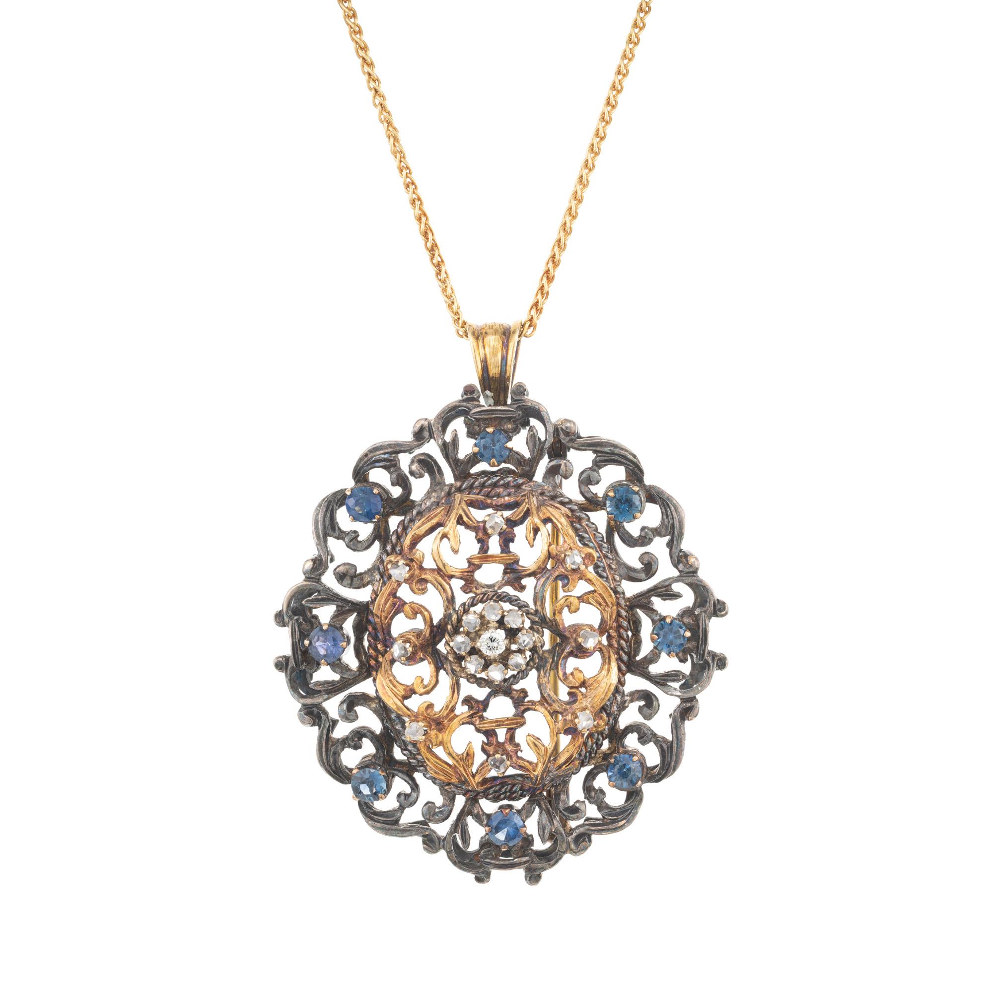 Spectacular 1920's Victorian Revival sapphire and diamond pendant, necklace and brooch. One old mine cut center diamond mounted in handmade 18k yellow gold and silver open work pendant. Amazing detail and craftsmanship adorned with 8 rose cut