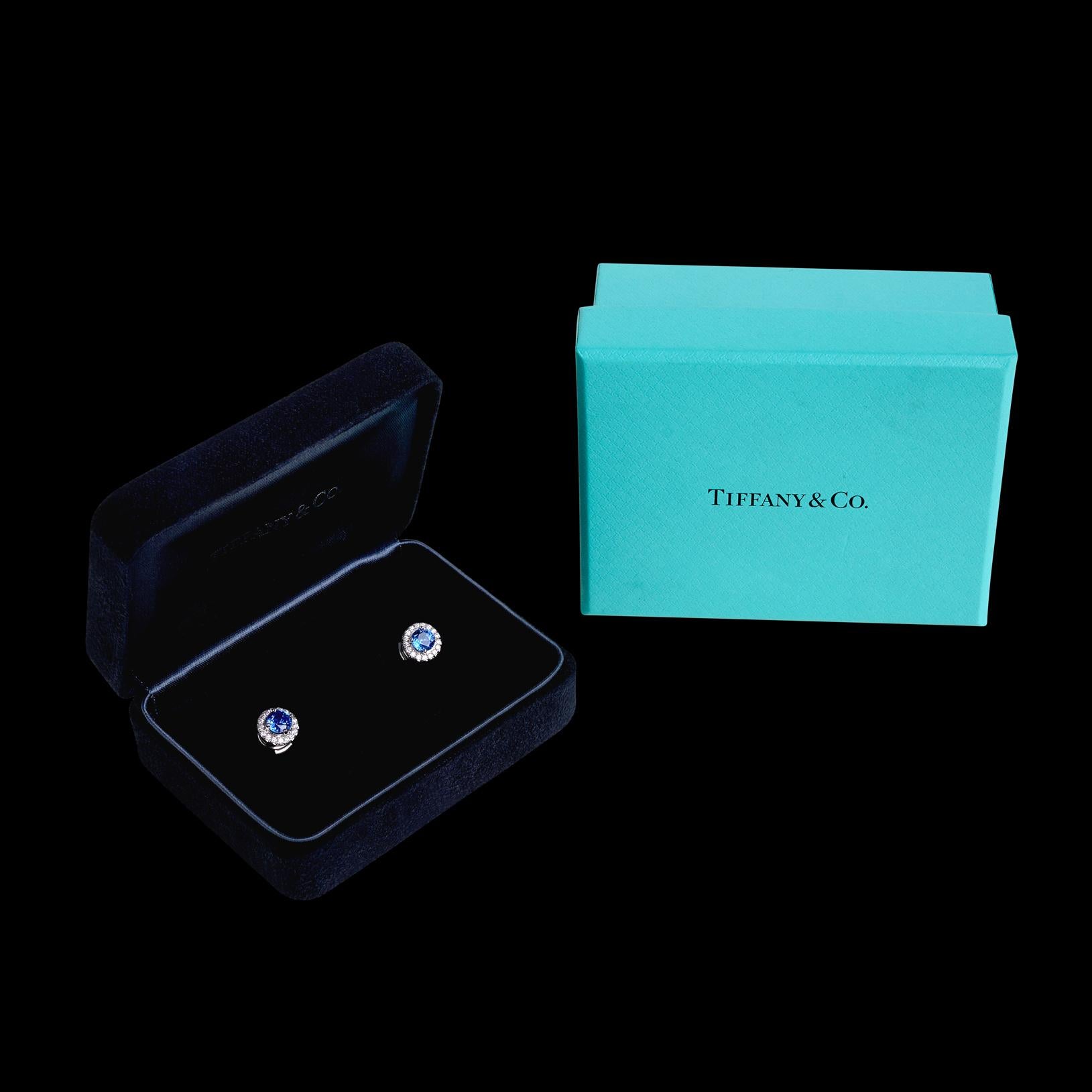 The perfect pair of earrings! From the one and only Tiffany and Co. comes these highly sought after sapphire and diamond halo earrings from their 