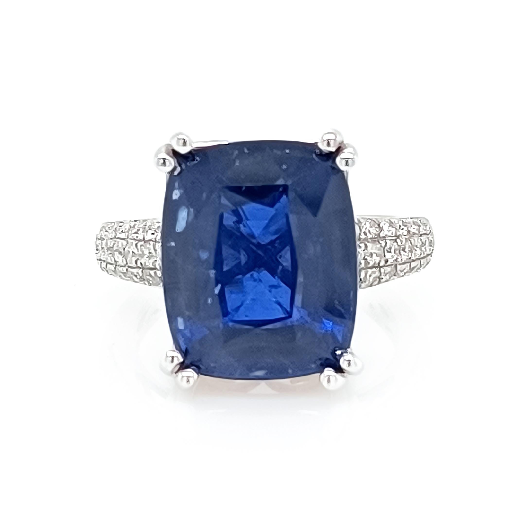 14.07 Ct Sapphire set in white gold and diamond pave set band 

Diamonds 0.49 Cts 
14K white gold, 5.58 Grams
