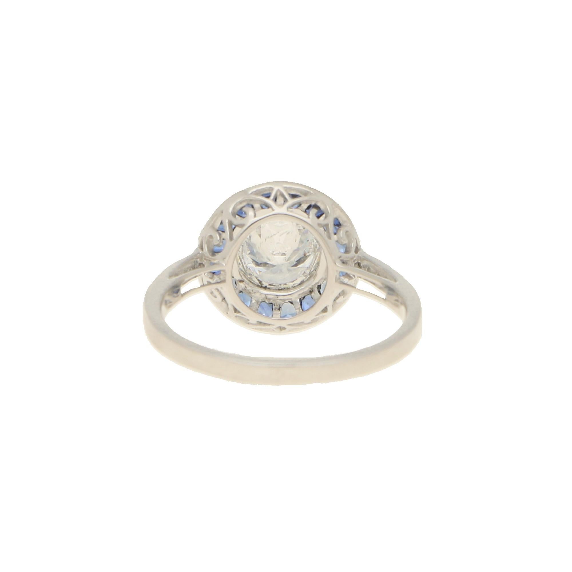 Round Cut Art Deco Style Sapphire and Diamond Target Engagement Ring in Platinum
