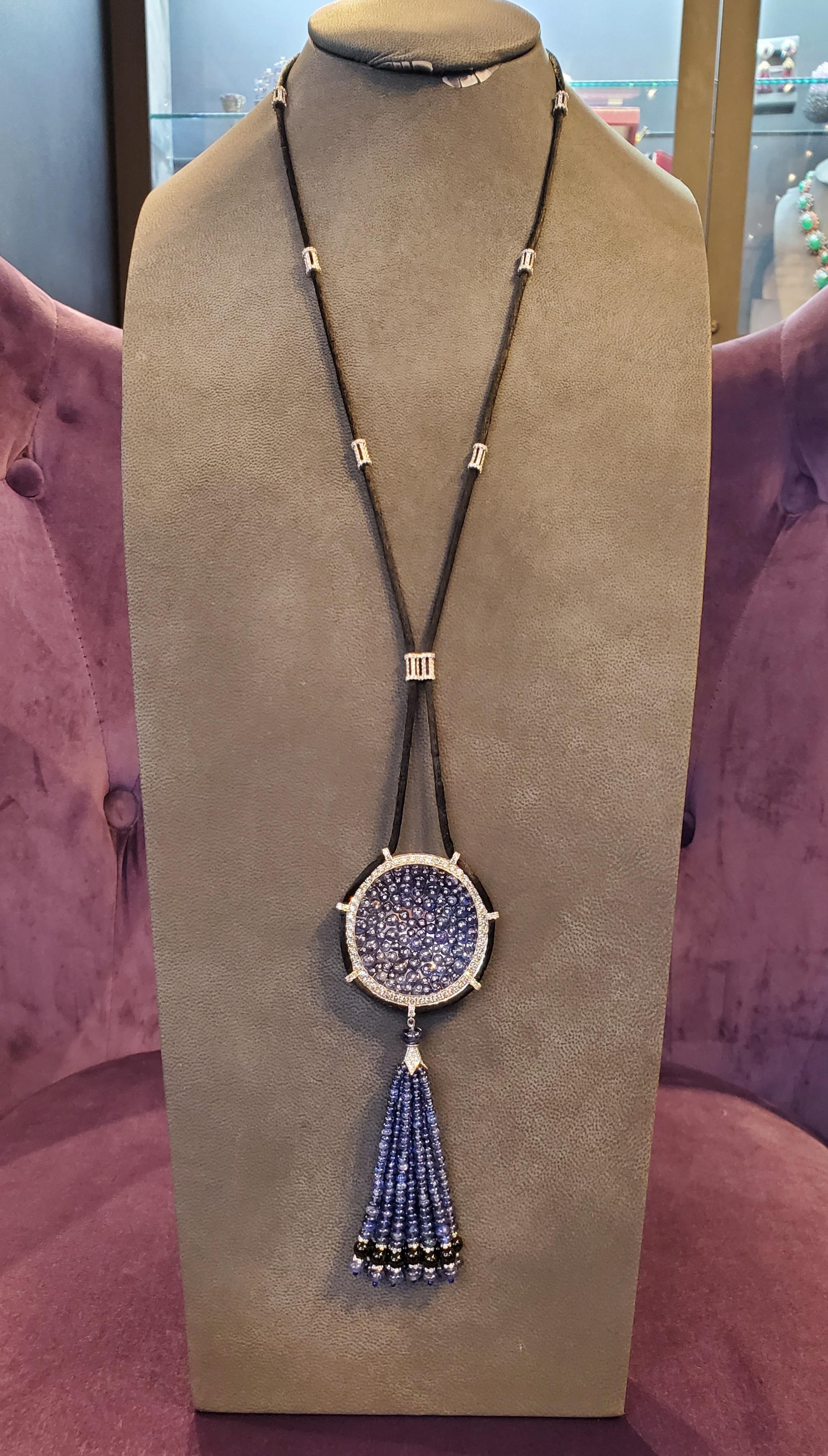 Sapphire & Diamond Sautoir Tassel Necklace

Length: approximately 28 inches 

Features an array of sapphires surrounded by diamonds followed by strands with sapphire beads mounted on silk