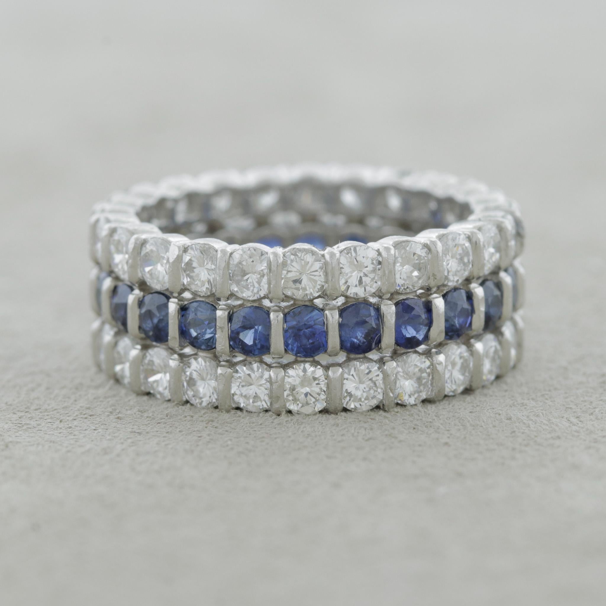 A sleek and chic eternity band featuring two rows of round brilliant-cut diamonds, weighing 2 carats, along a single row of bright blue sapphire between the diamonds weighing 1.40 carats. Hand-fabricated in platinum, a slightly wider eternity band