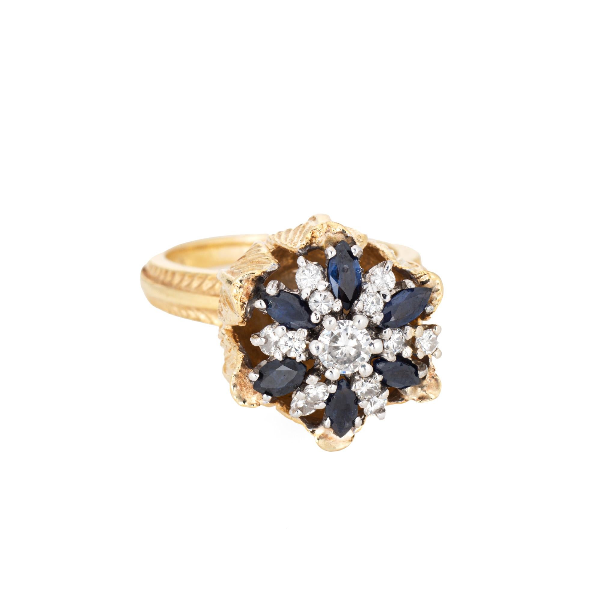 Stylish sapphire & diamond tulip ring crafted in 18 karat yellow gold (circa 1960s to 1970s). 

Round brilliant cut diamonds total an estimated 0.39 carats (estimated at H-I color and VS2-SI2 clarity). Marquise cut sapphire are estimated at 0.10