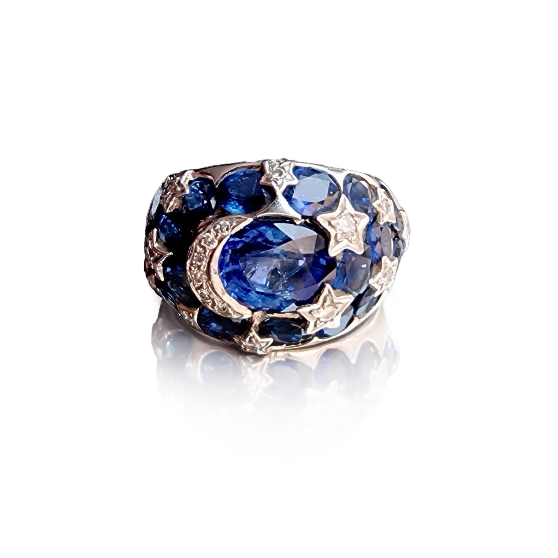 Sapphire Diamond White Gold 18K Ring.
Ring size: 6 3/4
Central Sapphire size: 9.30 x 7 x 5 mm.
18 small oval Sapphire 4.65 x 3.45 x 2.38 mm. each.