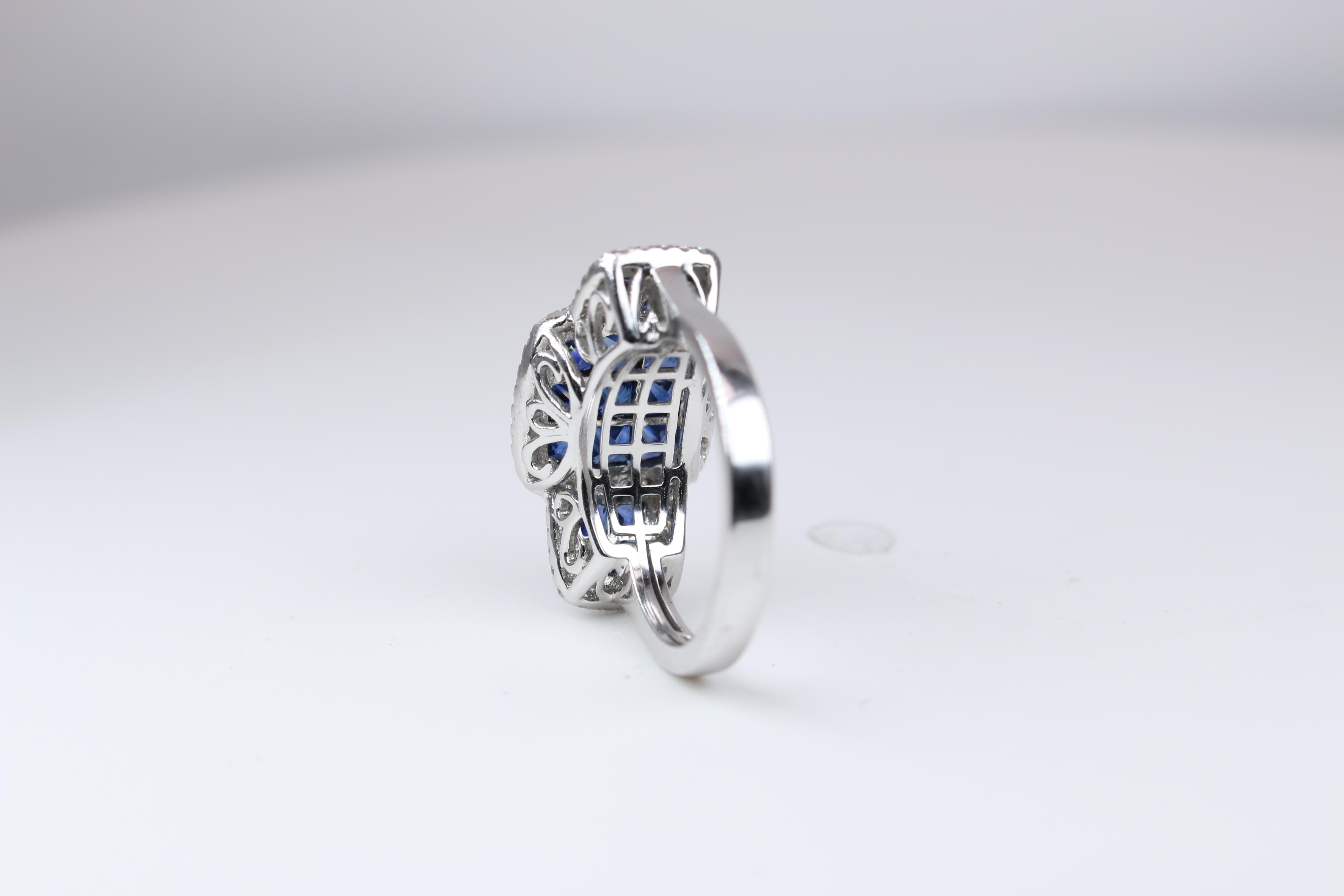 This stunning ring is set with Sapphires (2.40 TCW) and Diamonds (.48 TCW) in 14k white gold.