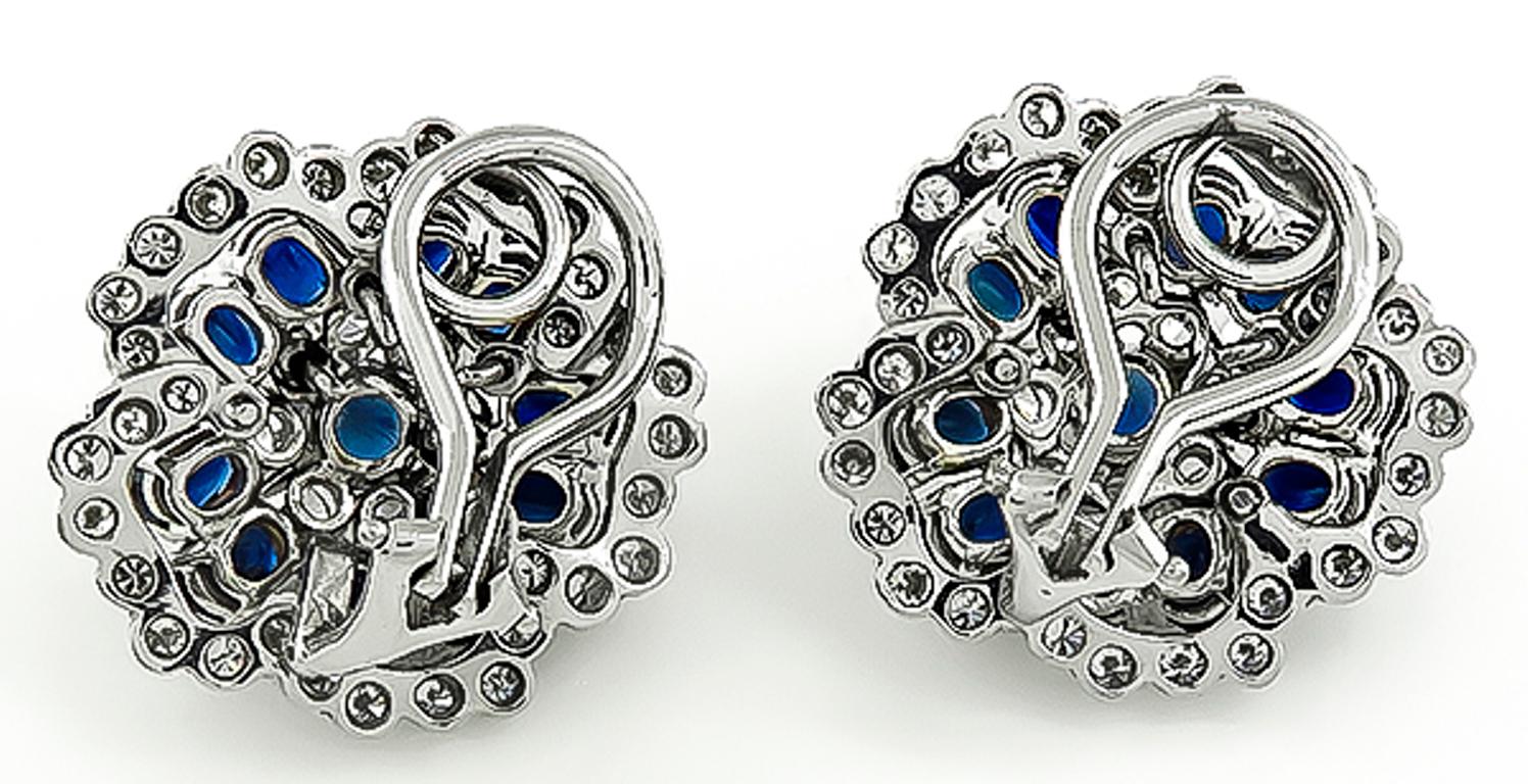 This charming pair of 14k white gold earrings feature lovely oval and round cut sapphires that weigh approximately 3.50ct. The sapphires are accentuated by sparkling round cut diamonds that weigh approximately 2.25ct. graded H color with VS clarity.
