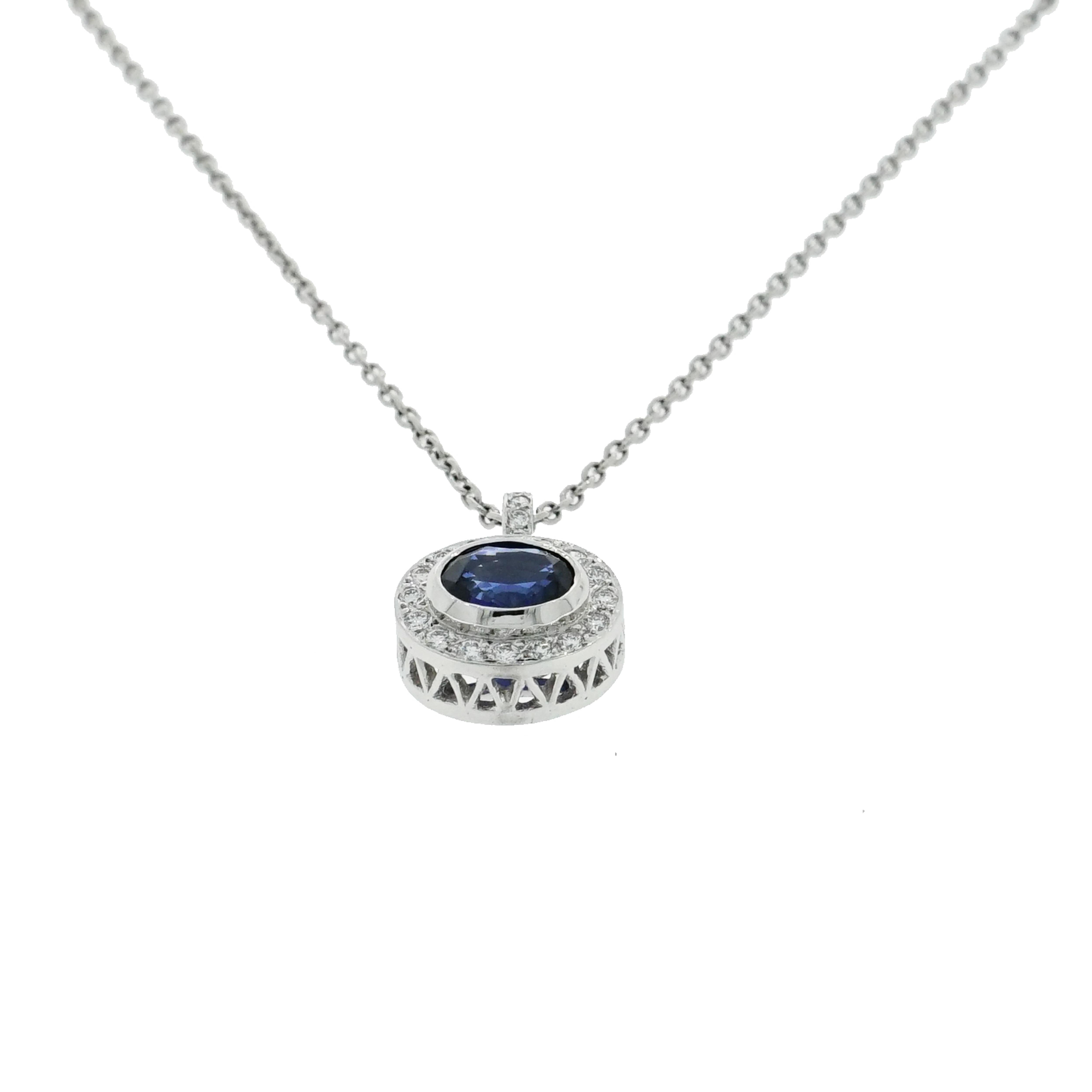 This beautiful Sapphire and Diamond pendant combined a 2.50 carat oval shaped Sapphire set east-west surrounded with approximately 0.50 carat of round brilliant cut diamonds in a gorgeous filigree style halo setting. 
The top of the pendant has a