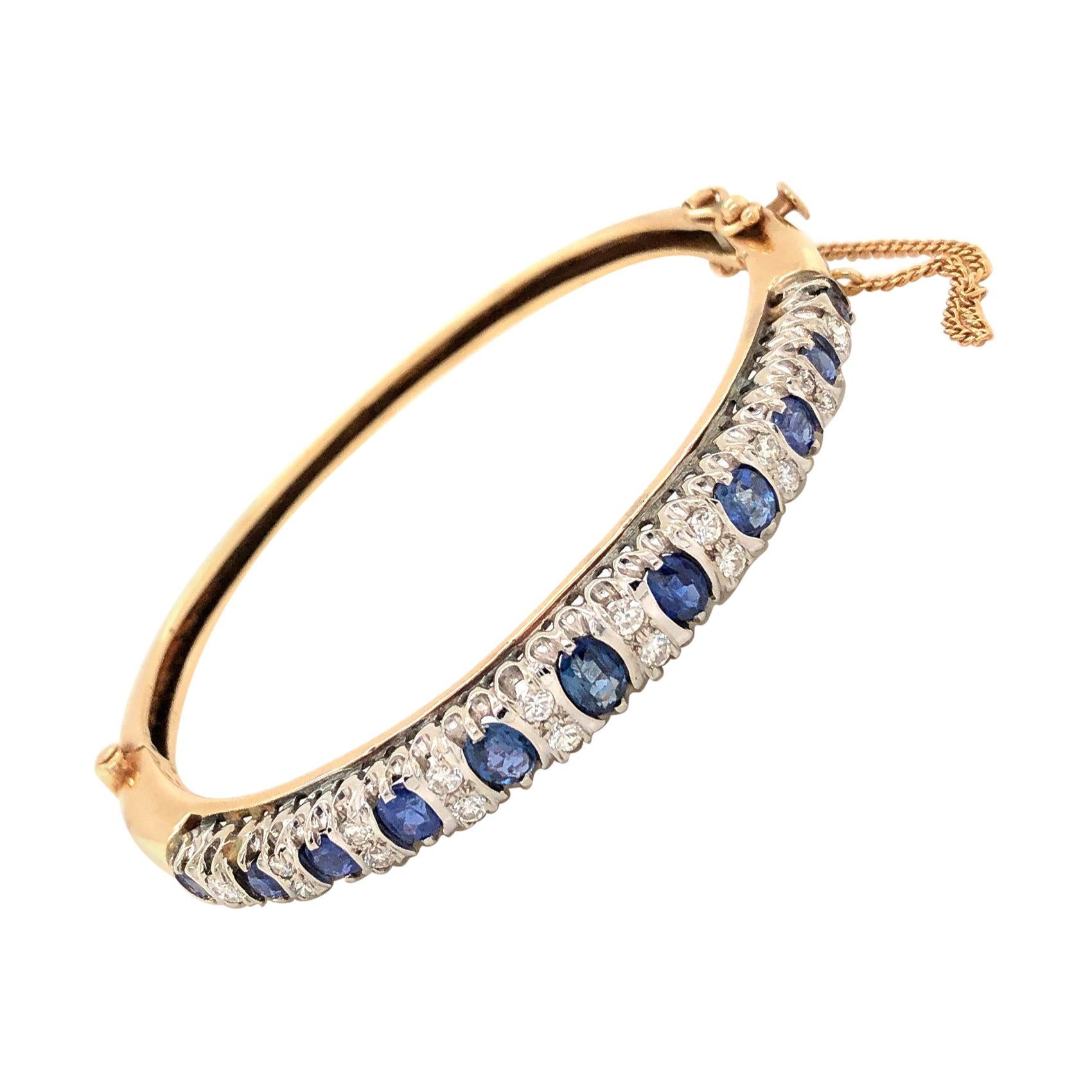 Armreif aus 14 Karat Gelbgold mit blauem blauen Saphir und Diamant