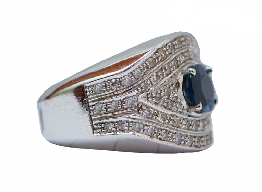 Elegant band ring in 14 kt white gold structure mounted with a central sapphire surrounded by a frame of diamonds.
This ring was totally handmade by Italian master goldsmiths and it is in perfect conditions.
Diamonds 2.25 ct
Sapphire 2.90 ct
Total