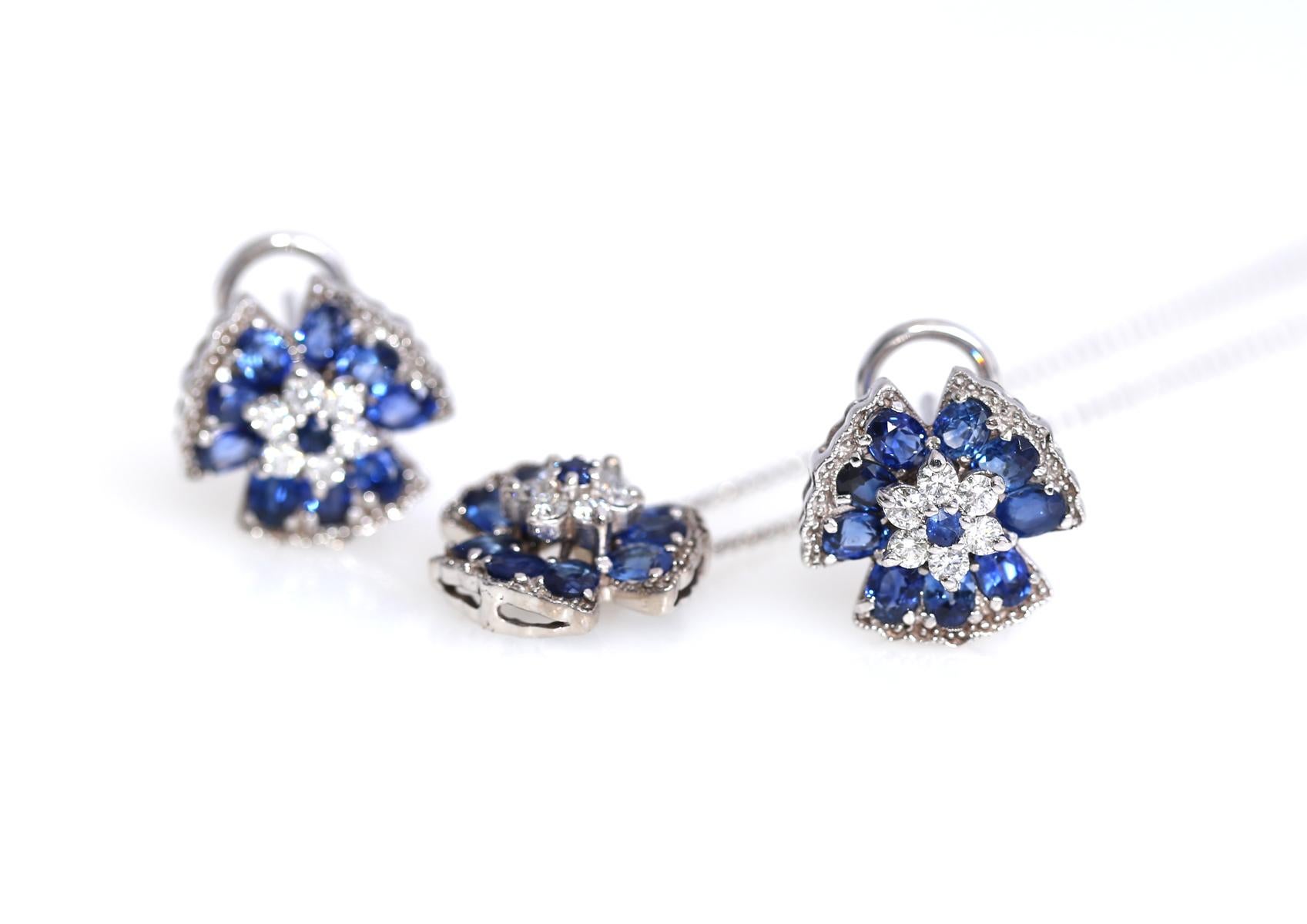 Modern stylish and delicate Sapphire Diamonds Pendant and Earrings Set. Depicting a sophisticated flower ornament, the design matches in earrings and a pendant. White Gold 14 Karat, fine Sapphires are used to underline the beautiful Diamonds.