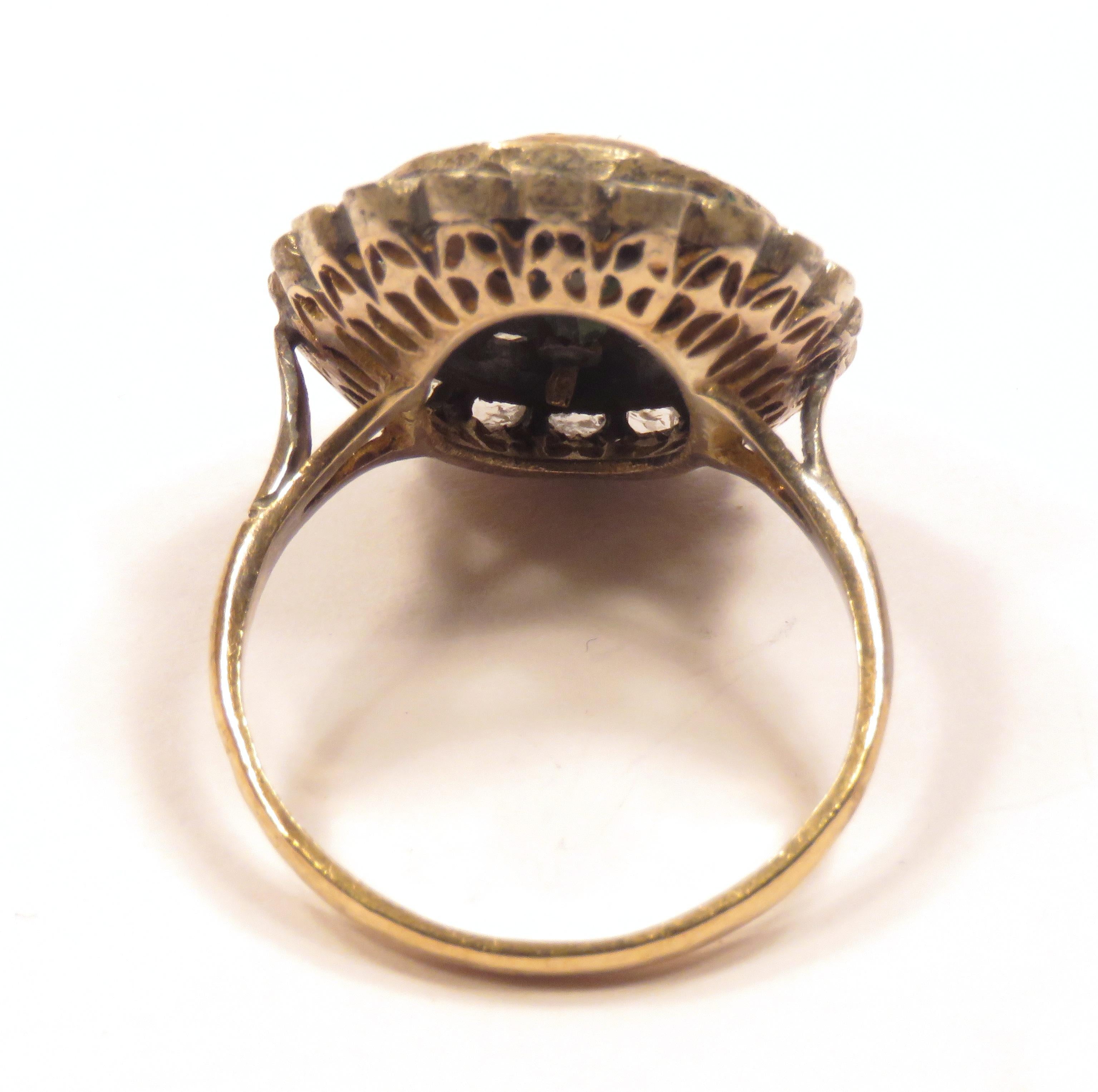 Antique Dome Ring in Silver and Yellow Gold with 40 Diamonds Rose Cut and one Oval Sapphire. This vintage ring dates early 1900s.
The size of the oval sapphire is 9 X 6 millimeter / 0.354331 X 0.23622 inches.
The size of the oval with diamonds is 22