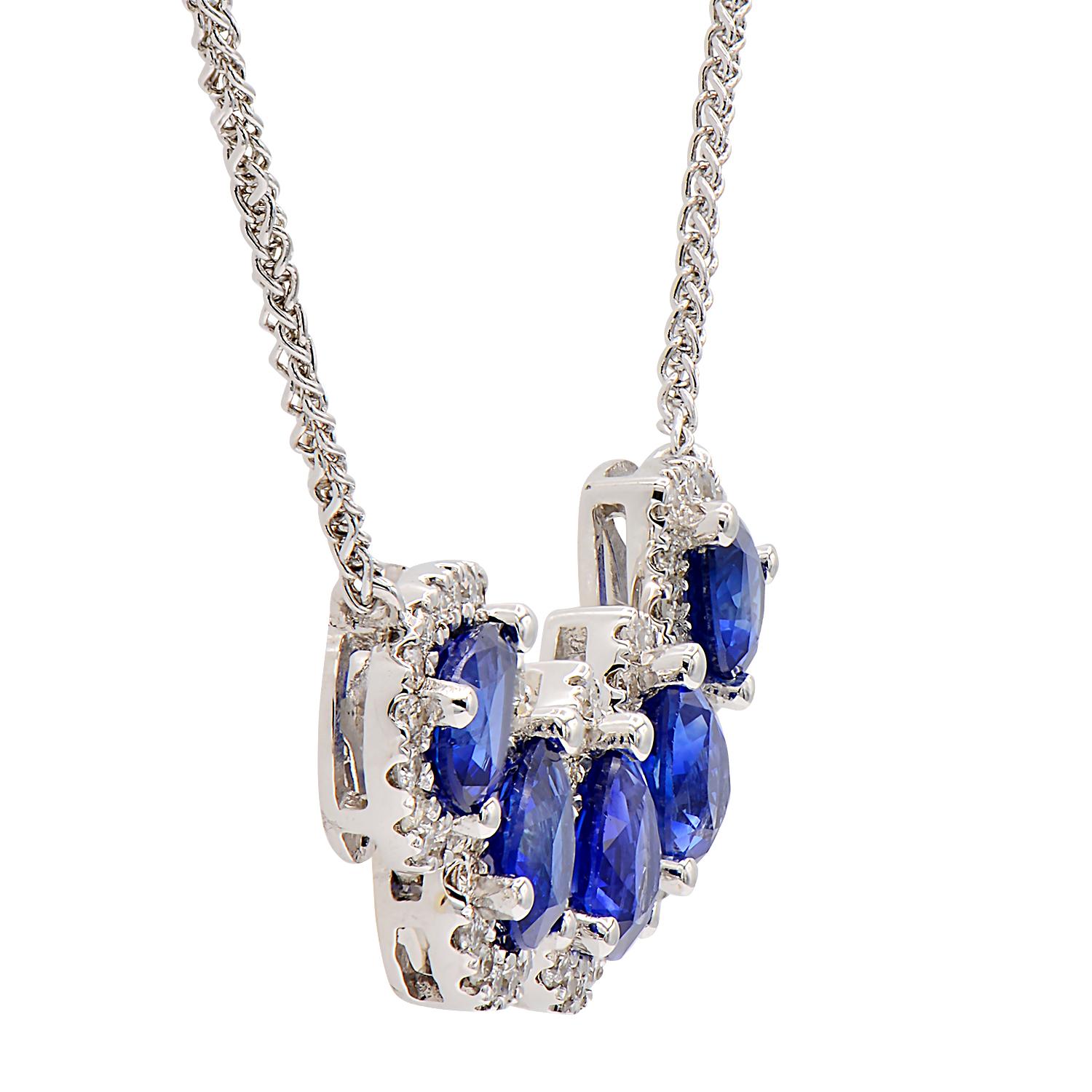 This gorgeous necklace is made from 5 blue drop shape sapphires totaling 1.89 carats which are circled by a beautiful diamond halo made from 80 round VS2, G color diamonds totaling 0.41 carats. They are set in 2.6 grams of 18 karat white gold and