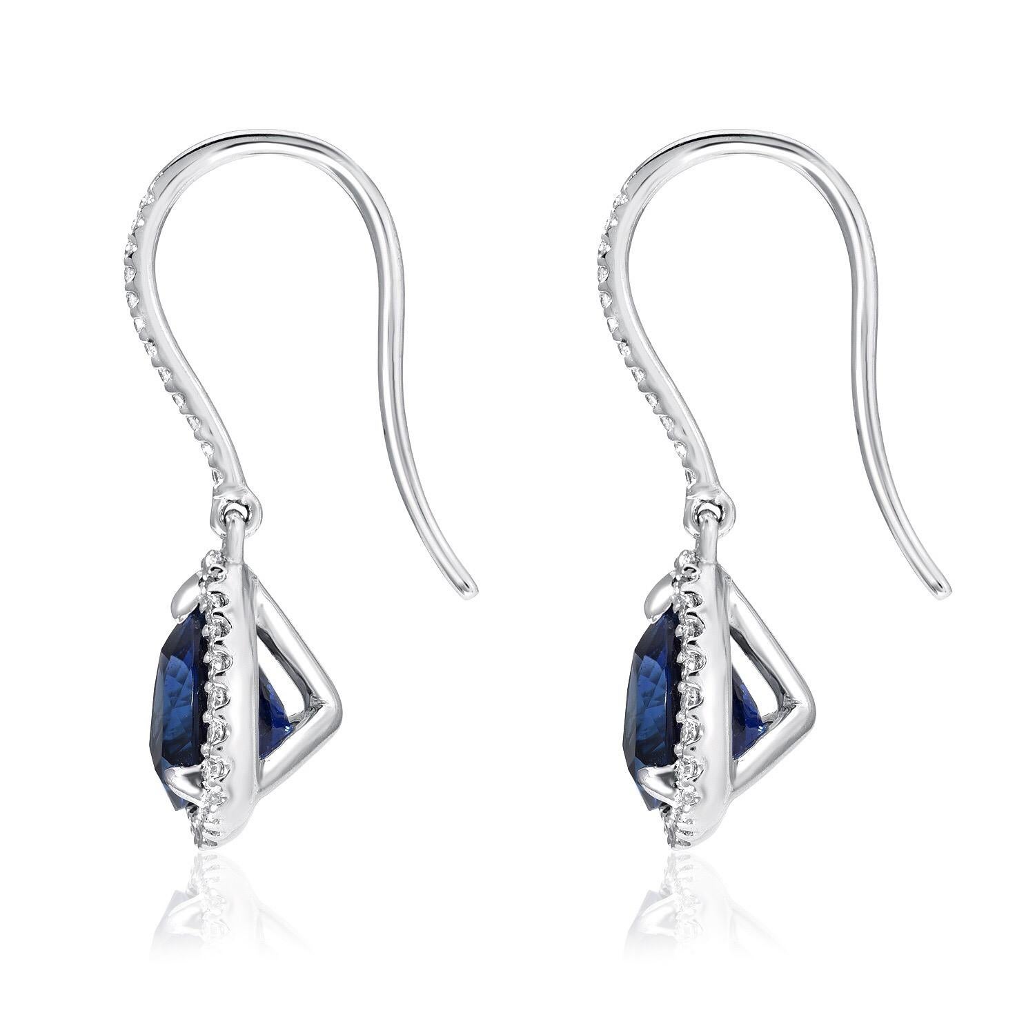 Sapphire earrings, featuring a pair of trillion shaped blue Sapphires weighing a total of 3.14 carats and adorned by a total of 0.23 carats of round brilliant diamonds. Crafted in 18K white gold.
Total length: 0.75 inches.
Returns are accepted and