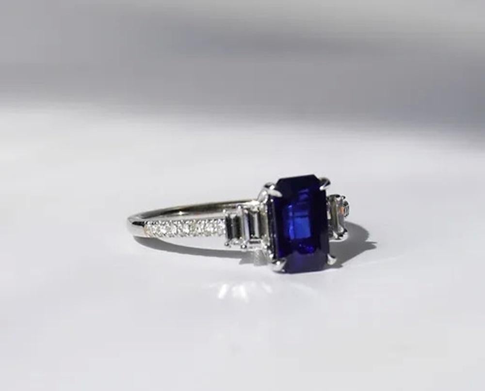 Sapphire Weight: 1.82 ct, Measurements: 8x5 mm, Diamond Weight: 0.35 ct, Metal: 18K White Gold, Gold Weight: 2.14 gm, Ring Size: 6.5, Shape: Emerald-Cut, Color: Blue, Origin: Ceylon, Sri Lanka, Hardness: 9, Birthstone: September