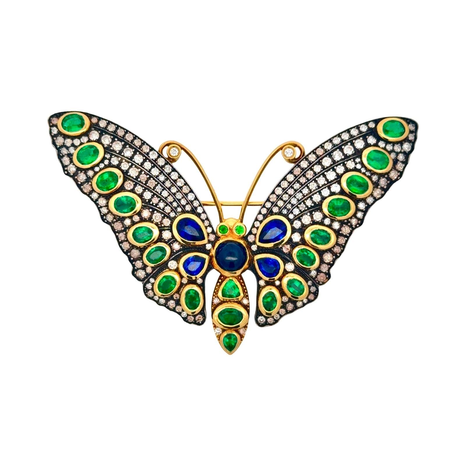 Estate Butterfly Brooch/Pendant, Round Brilliant Cut Diamond 2.95 cttw H-I SI1-SI2, 4 Sapphire Cabochon 4.14 cttw ,19 Emerald Mixed Cut 3.52 cttw  18K/Silver Yellow Gold

Jewelry Type : Brooch/Pendant
Jewelry Style : Butterfly
Metal Type :