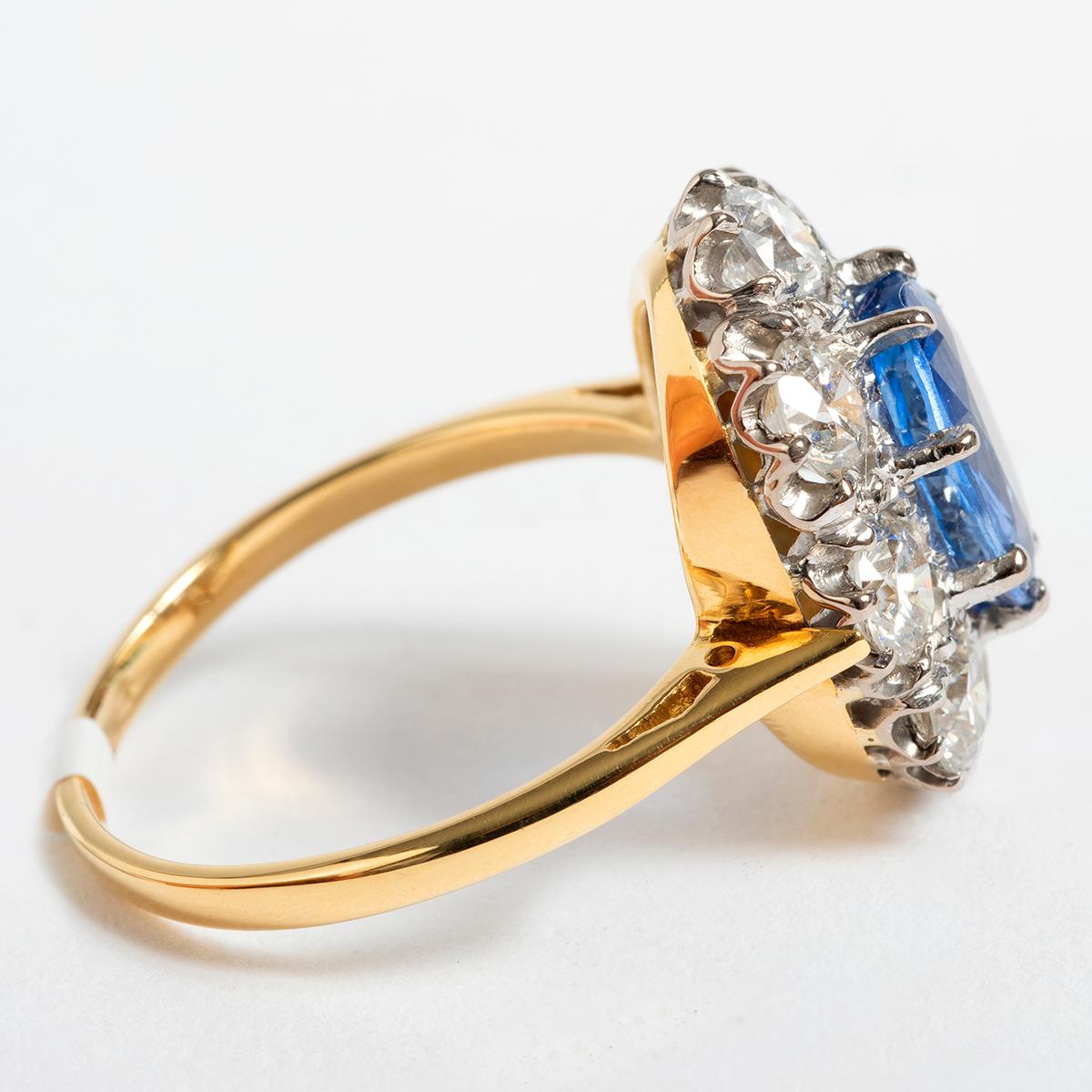 This exquisite and generous sapphire and diamond cluster ring is set in 18K Yellow Gold. The sapphire weighs est 1.58ct in diamonds est 1.75ct, clarity and colour h/si. This ring comes in UK size N and US size 6.75.  