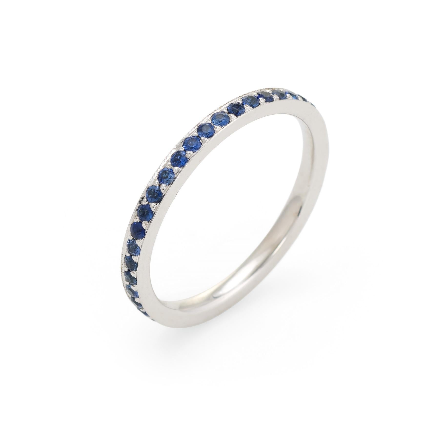 Elegant estate sapphire eternity band, crafted in 18 karat white gold. 

42 blue sapphires are estimated at 0.01 carats each, totaling an estimated 0.42 carats. The sapphires are in excellent condition and free or cracks or chips.  

The ring is in