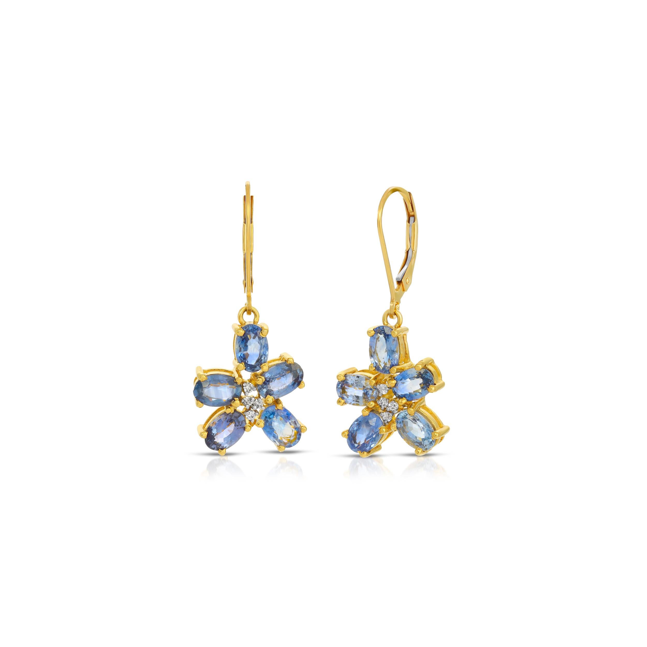 Spectacularly beautiful drop earrings of 18 Karat Gold featuring 6.05 Carats of luminous blue Sapphire petal flowers with 1.40 Carats of Brilliant Cut White Diamond centers. These fabulous earrings are suspended on gold hooks with secure lock
