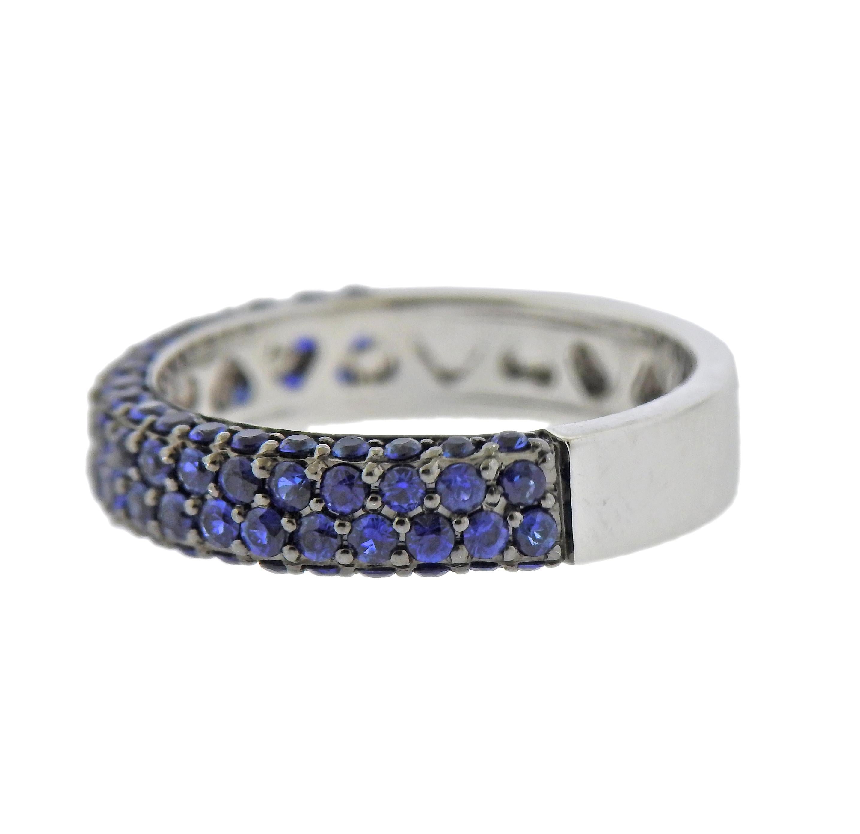 18k white gold half band ring with sapphires. Ring size - 5.5, ring is 4.3mm wide. Marked: 750. Weight - 3.7 grams.