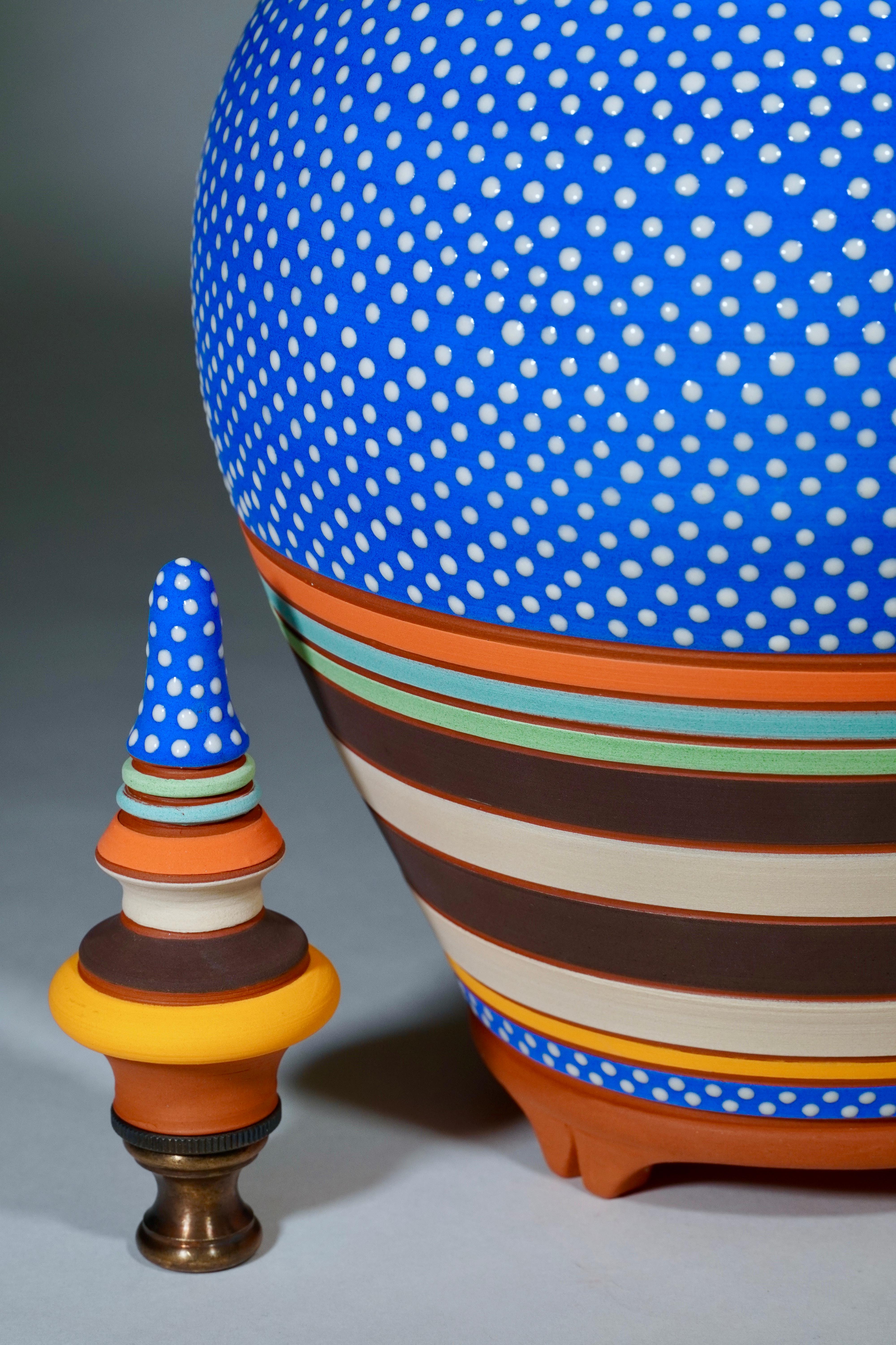 Sapphire is a one of a kind show stopper with her matte cobalt body embellished with tiny white gloss dots. This hand thrown, hand painted terra-cotta lamp is part of a series daphné created focusing on graphic line, color, and silhouette. As artful