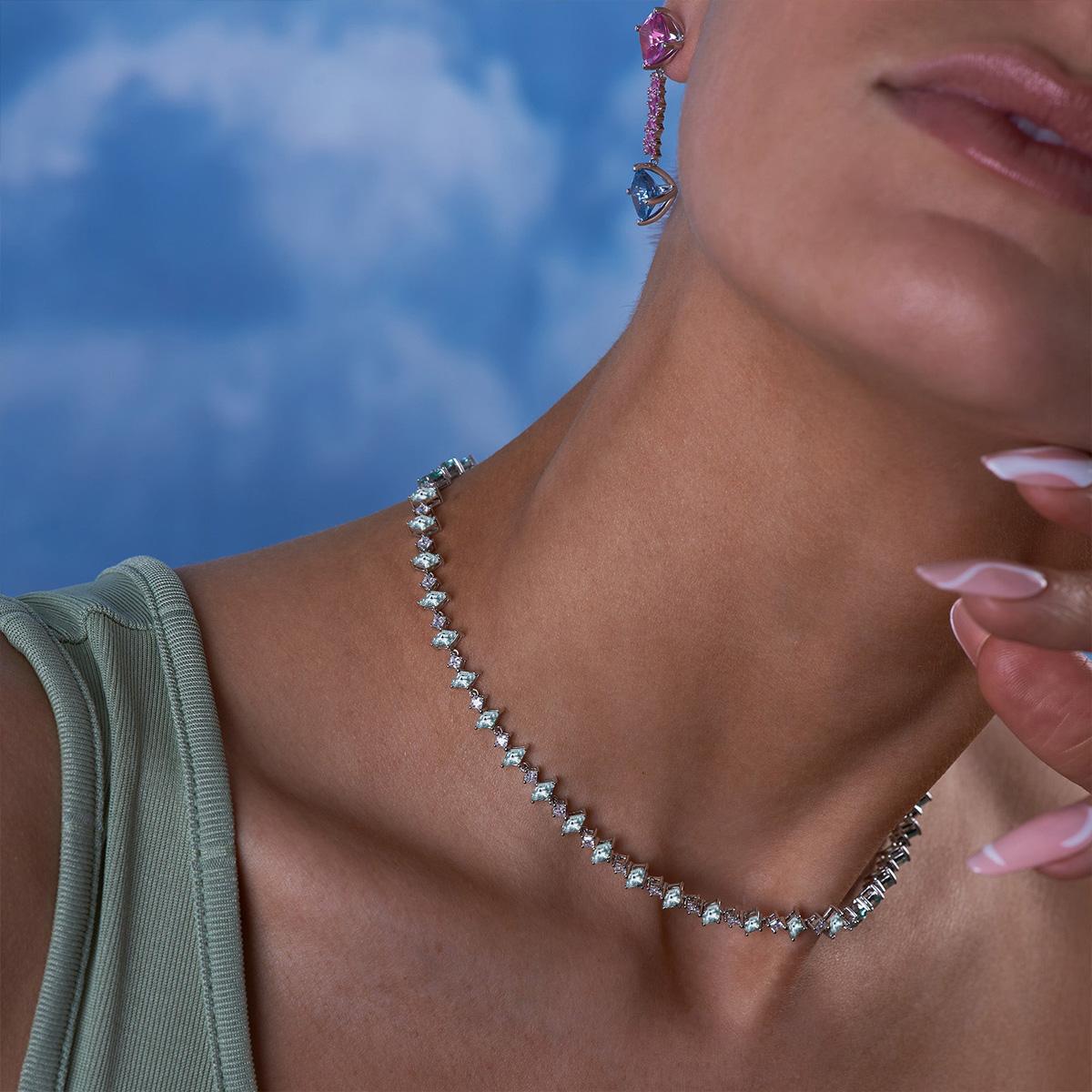 We are obsessed with the lozenge cut, enough to make a necklace that resembles the famous harlequin print. Featuring an alternating row of aquamarine lozenge sapphires and princess cut white sapphires, this necklace is extendable, so you can wear it