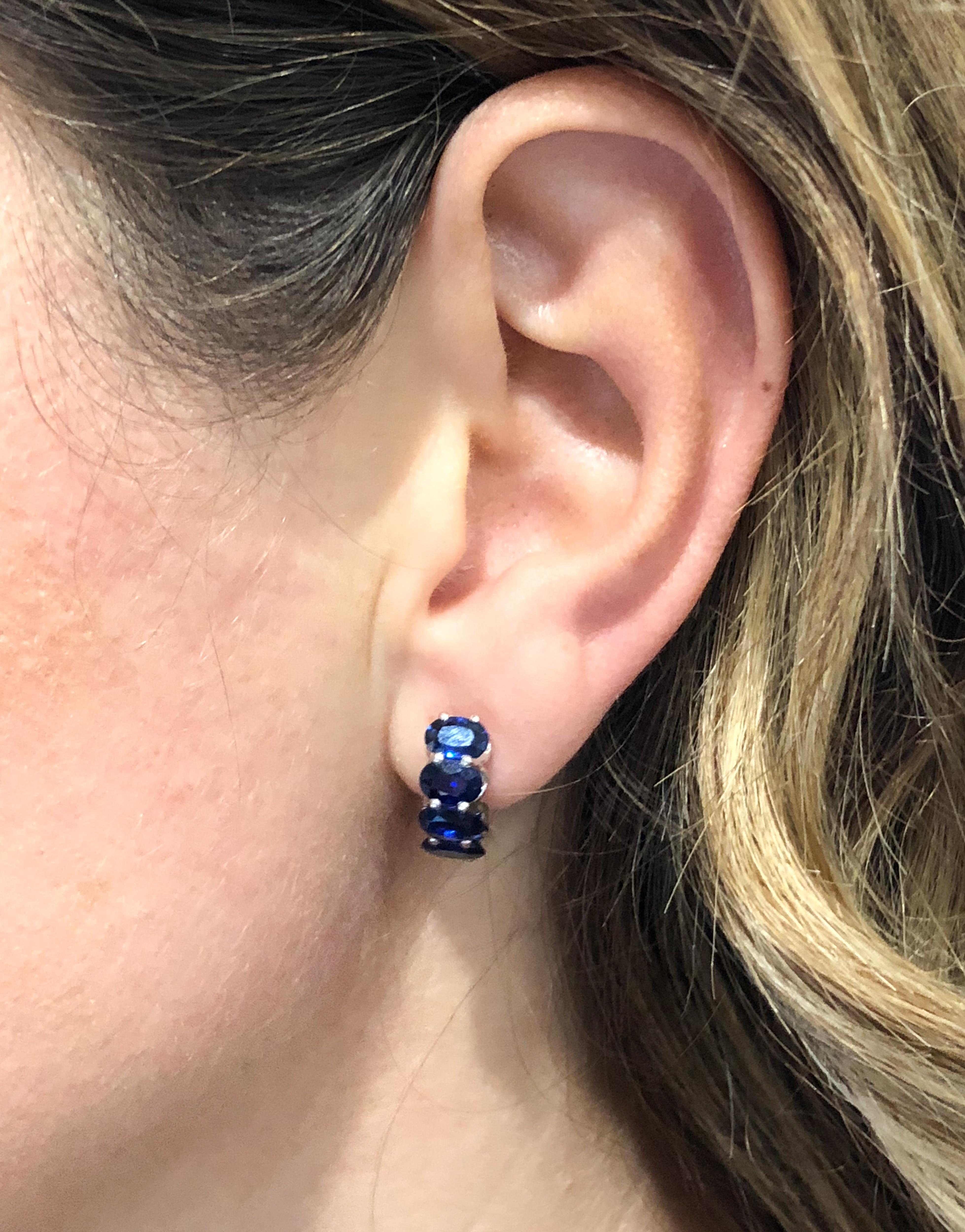 Oval Cut Sapphire Huggie White Gold Earrings For Sale