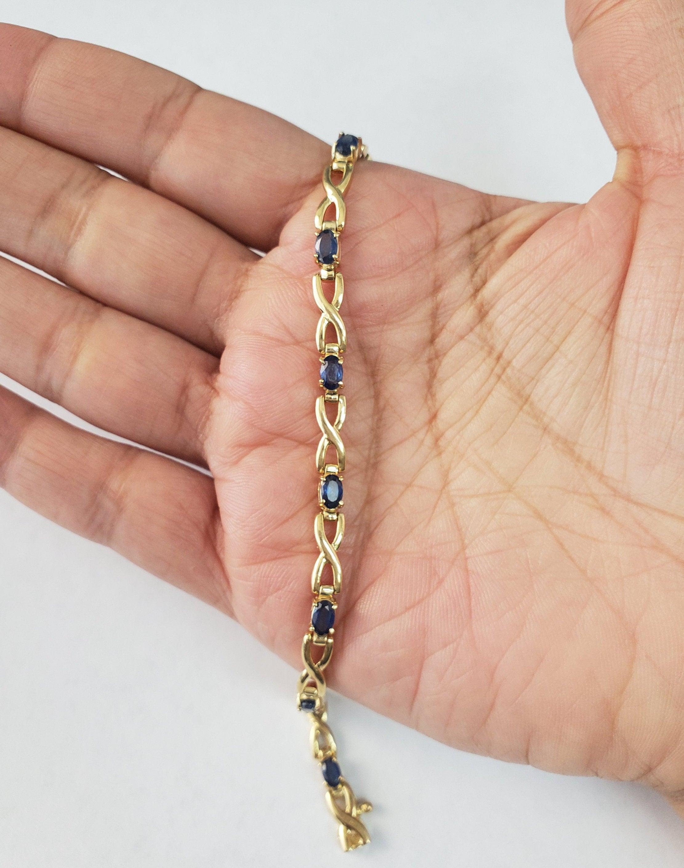 Taglio ovale Bracciale tennis Infinity con zaffiro 1,50cttw in oro giallo 14k in vendita
