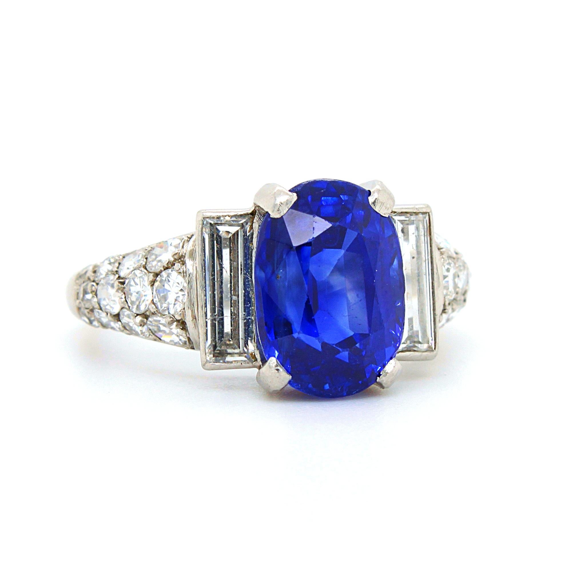 An Art Deco sapphire and diamond ring in platinum, France, ca. 1920s. The cushion shaped sapphire weighs 5.12 carats and is natural, not heated - accompanied by a gemological report by DSEF. The sapphire has a stunning royal blue colour and crystal